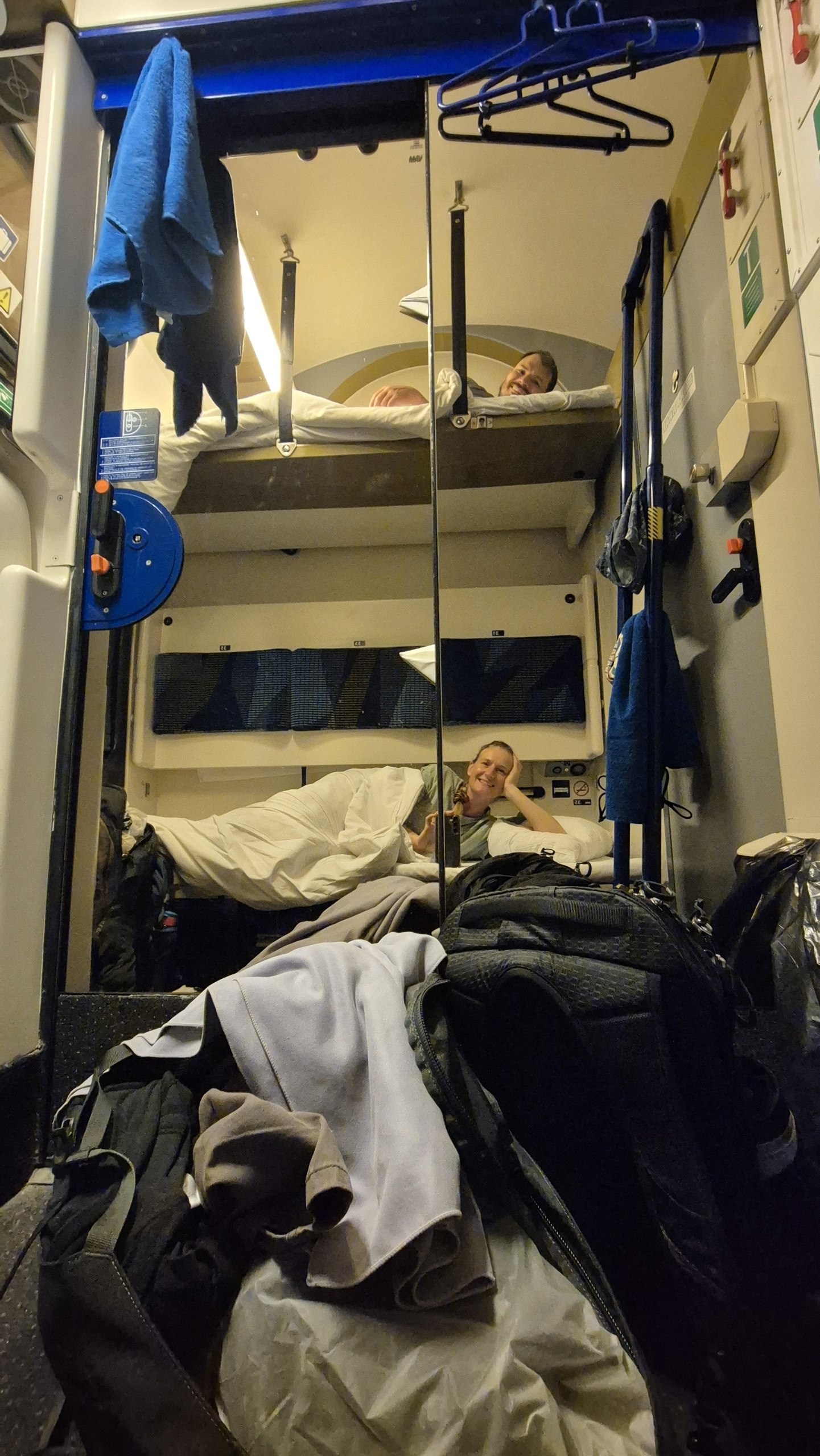 Hugo and Caro in their bunks inside the Nightjet sleeper compartment