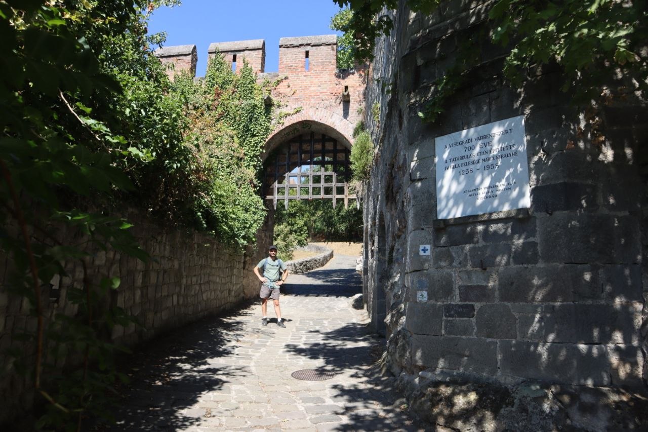 Hugo standing beneath the portcullis at the entrance to Visegrád Lower Castle