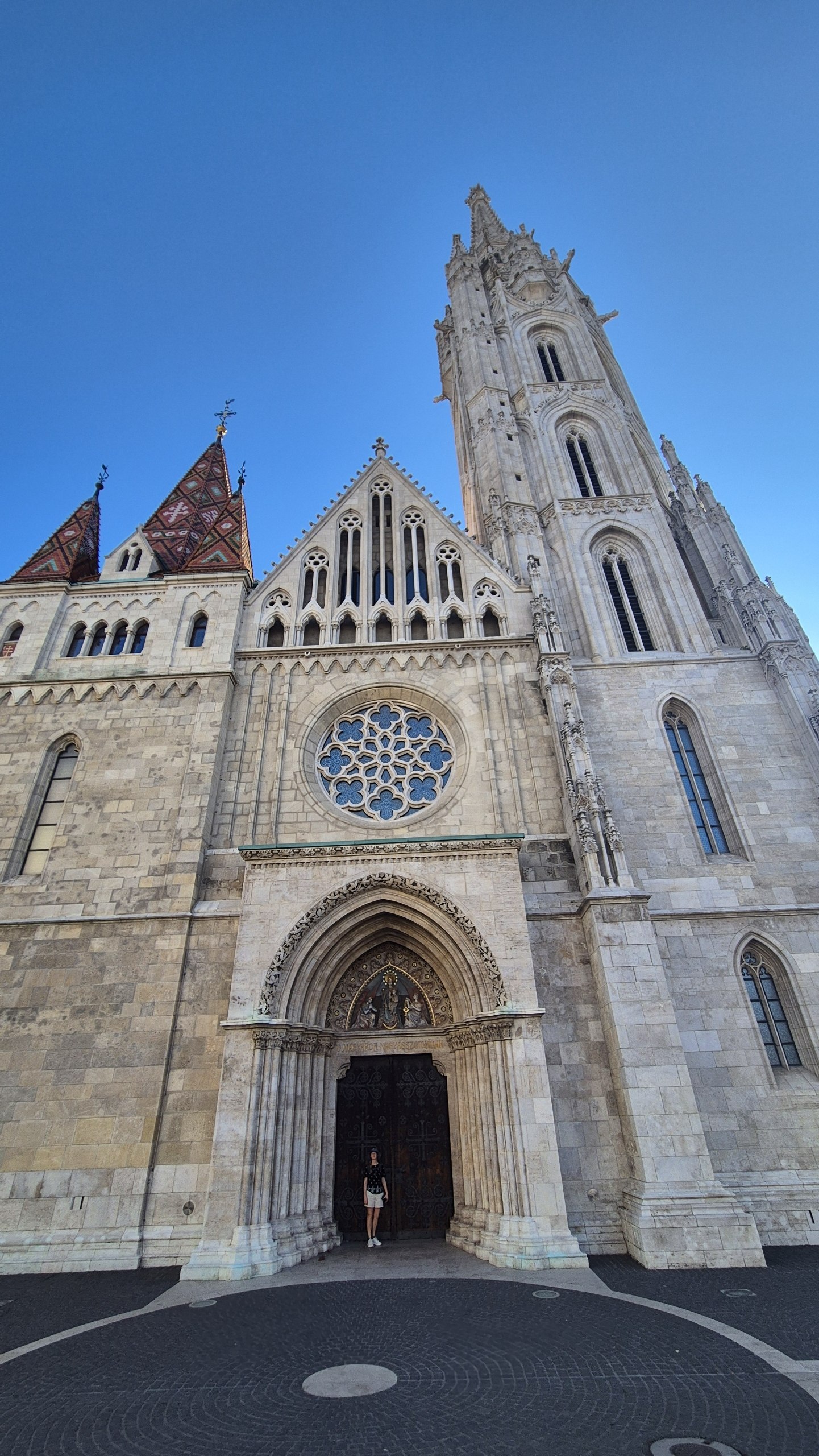 Caro standing in the doorway of Matthias Church in Budapest