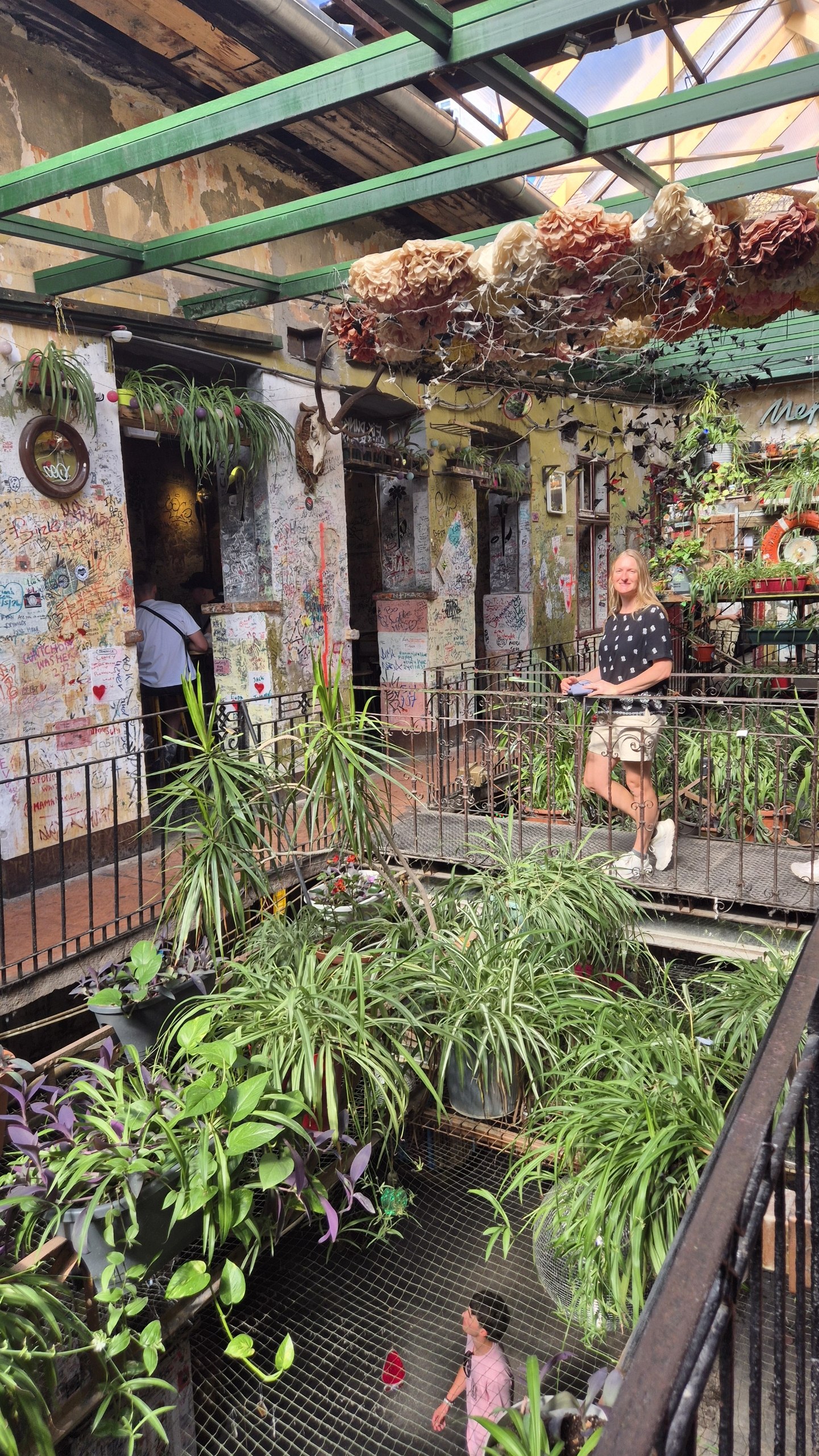 Caro exploring the plant-filled courtyard of Szimpla Kert ruin bar