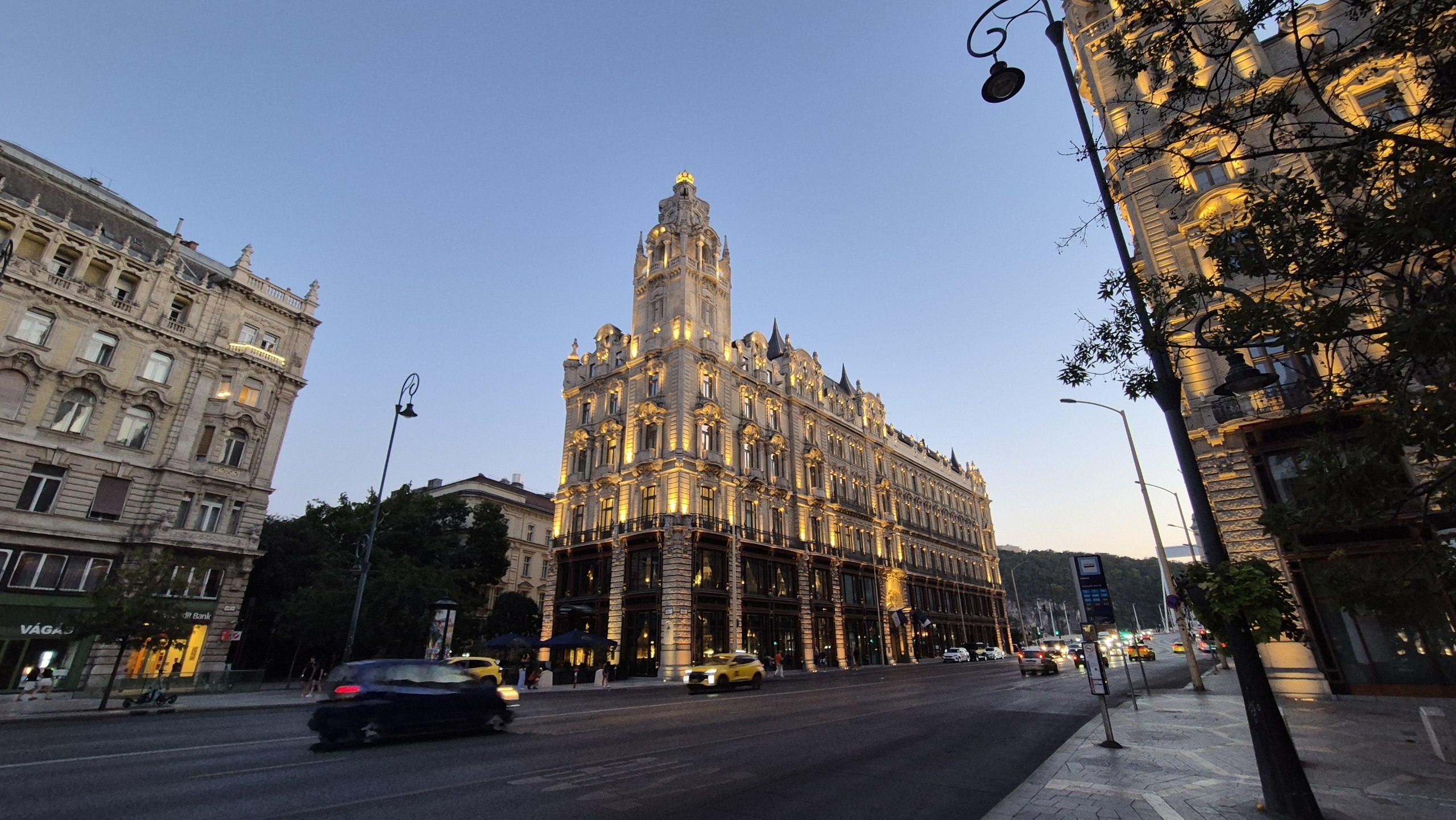 An ornate Budapest building illuminated after sunset