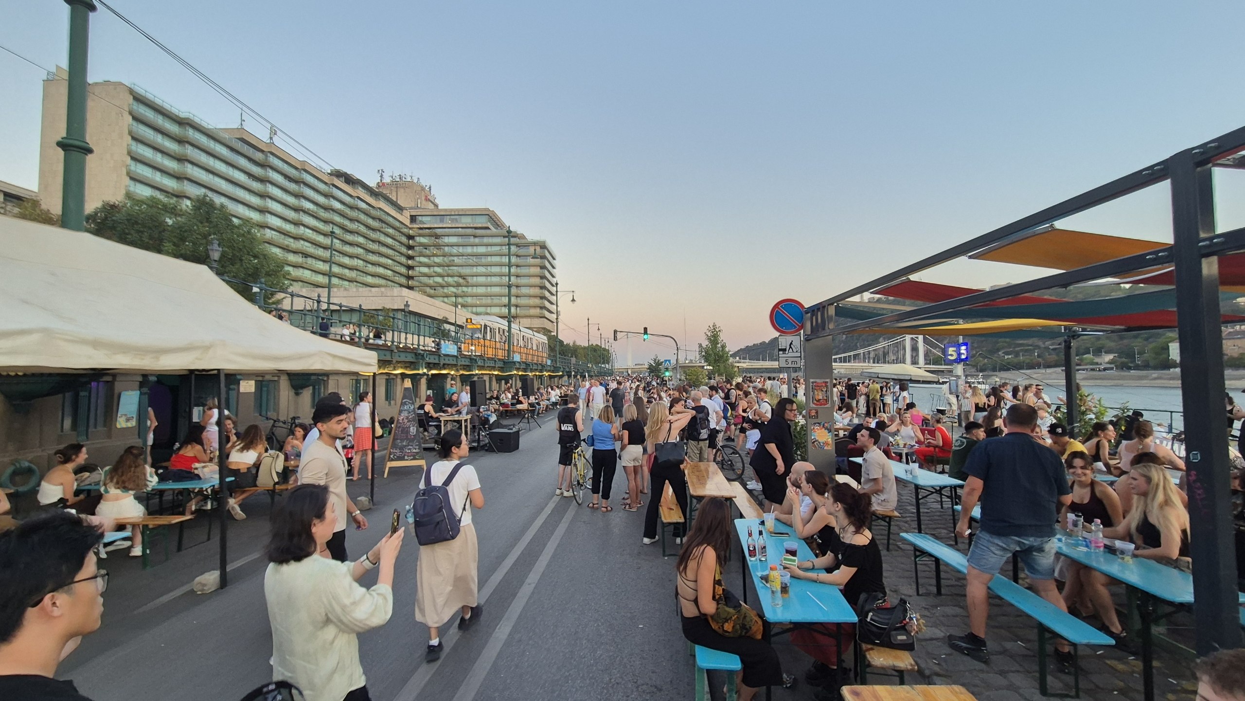 Crowds, stalls and bars along the Budapest riverside in the evening
