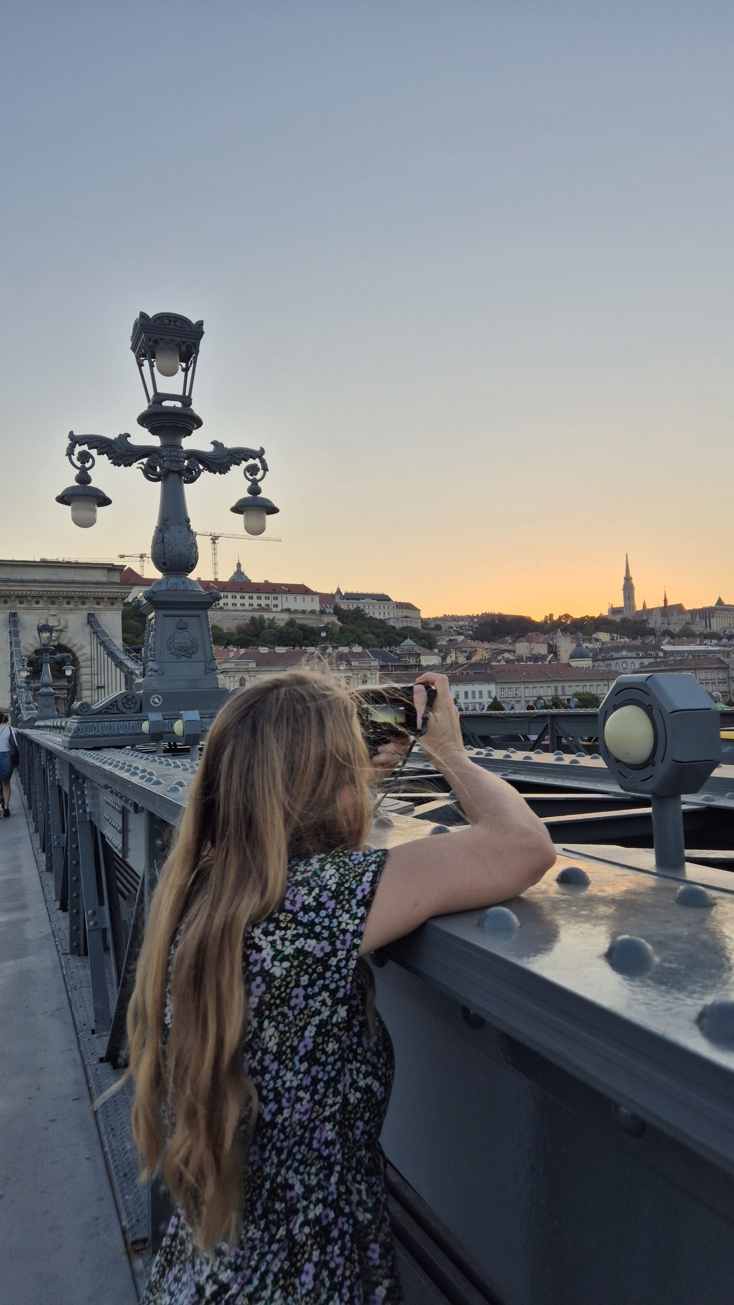 Caro looking over Chain Bridge and Budapest at sunset