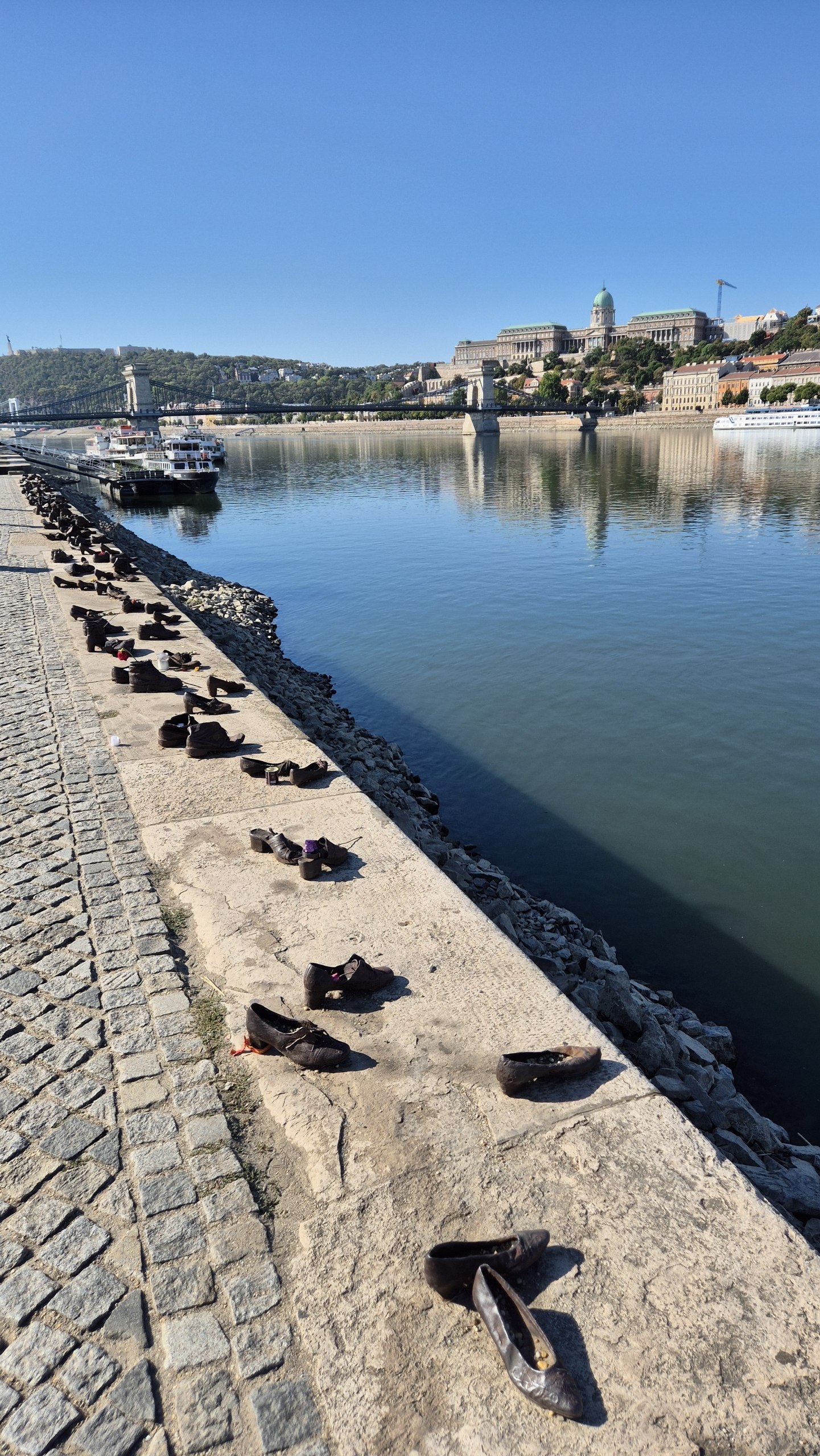 The Shoes on the Danube Bank memorial beside the low river in Budapest