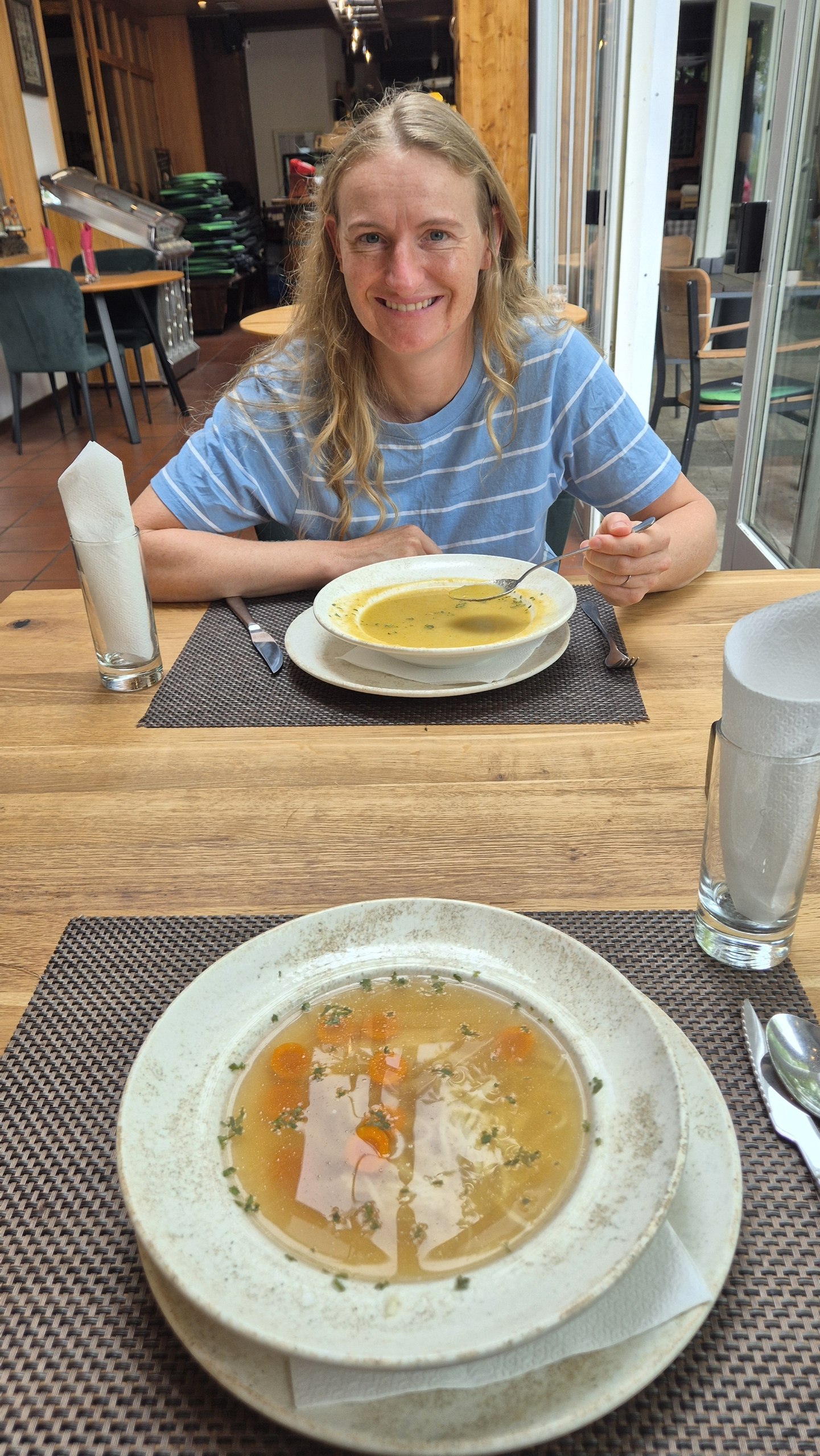 Caro and two bowls of soup at the restaurant below the guest house