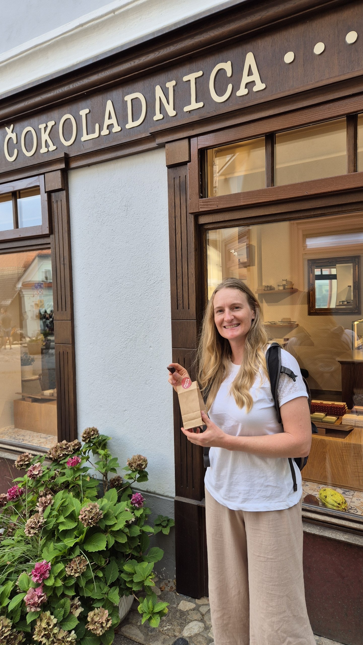 Caro outside a chocolate shop in Radovljica