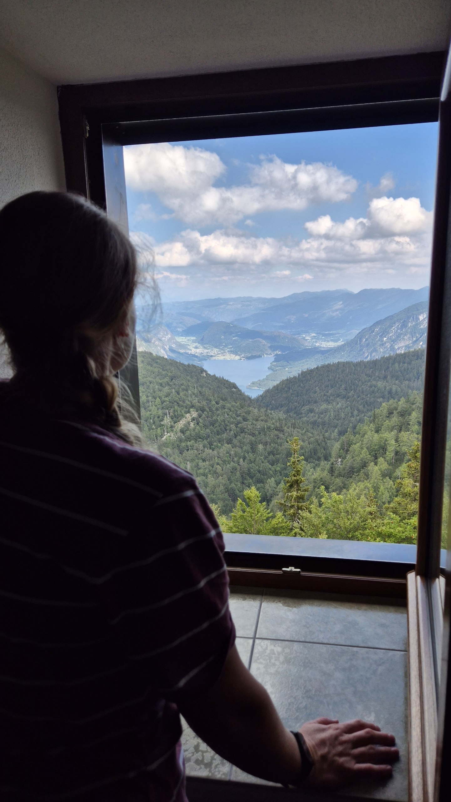 Caro looking over Lake Bohinj from the room at Dom na Komni