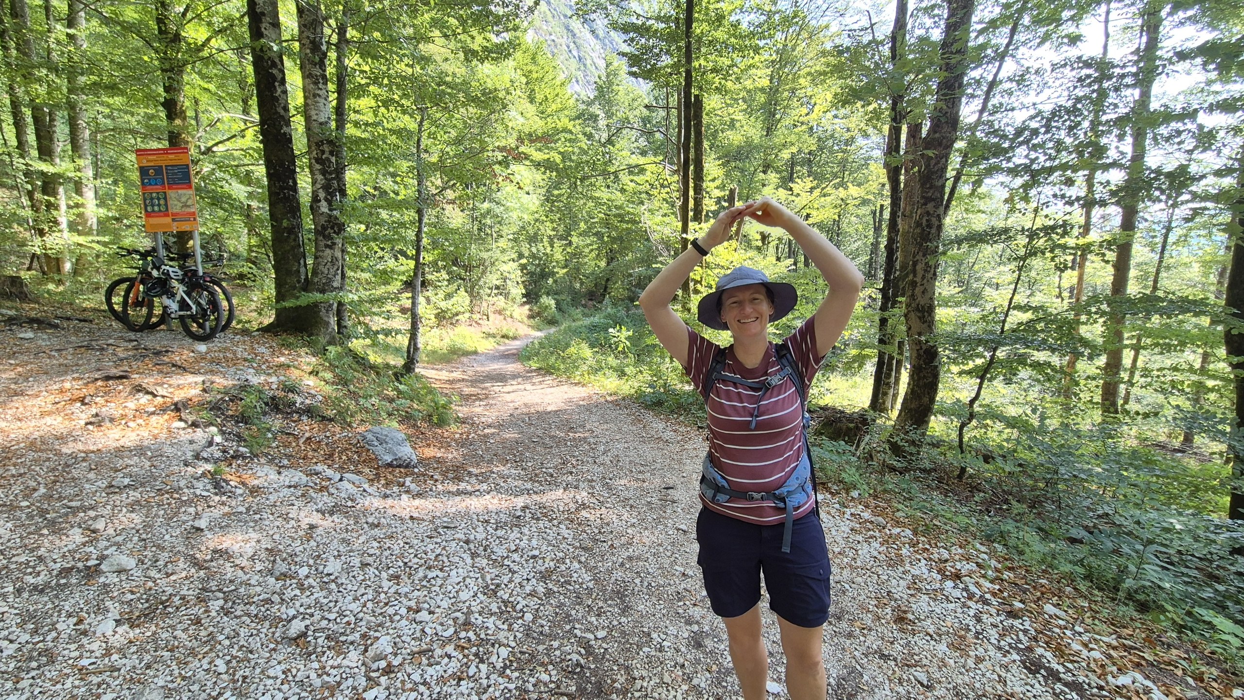 Caro making a circle with her arms where the descending trail crossed the previous day's route