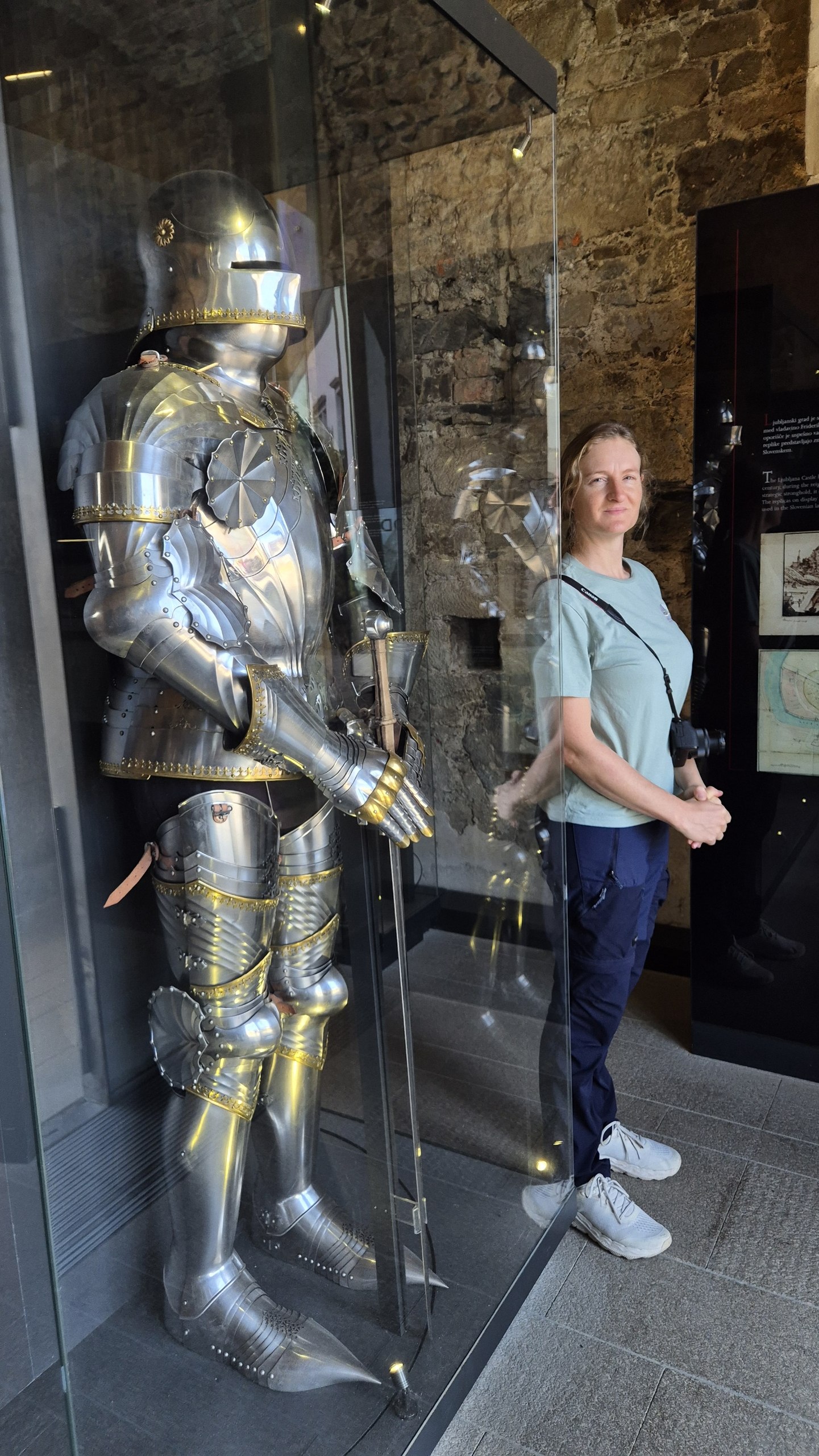 Hugo beside a suit of armour in the Ljubljana Castle Armoury
