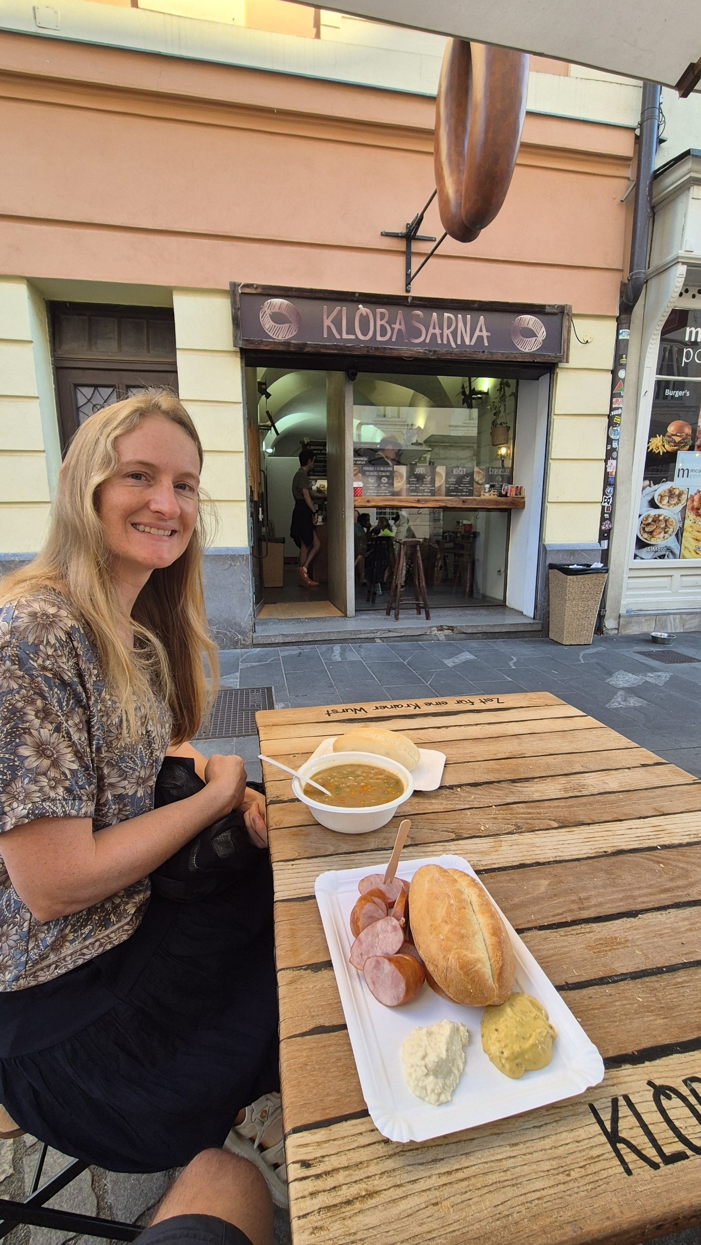 Caro at Klobasarna with ričet and Carniolan sausage