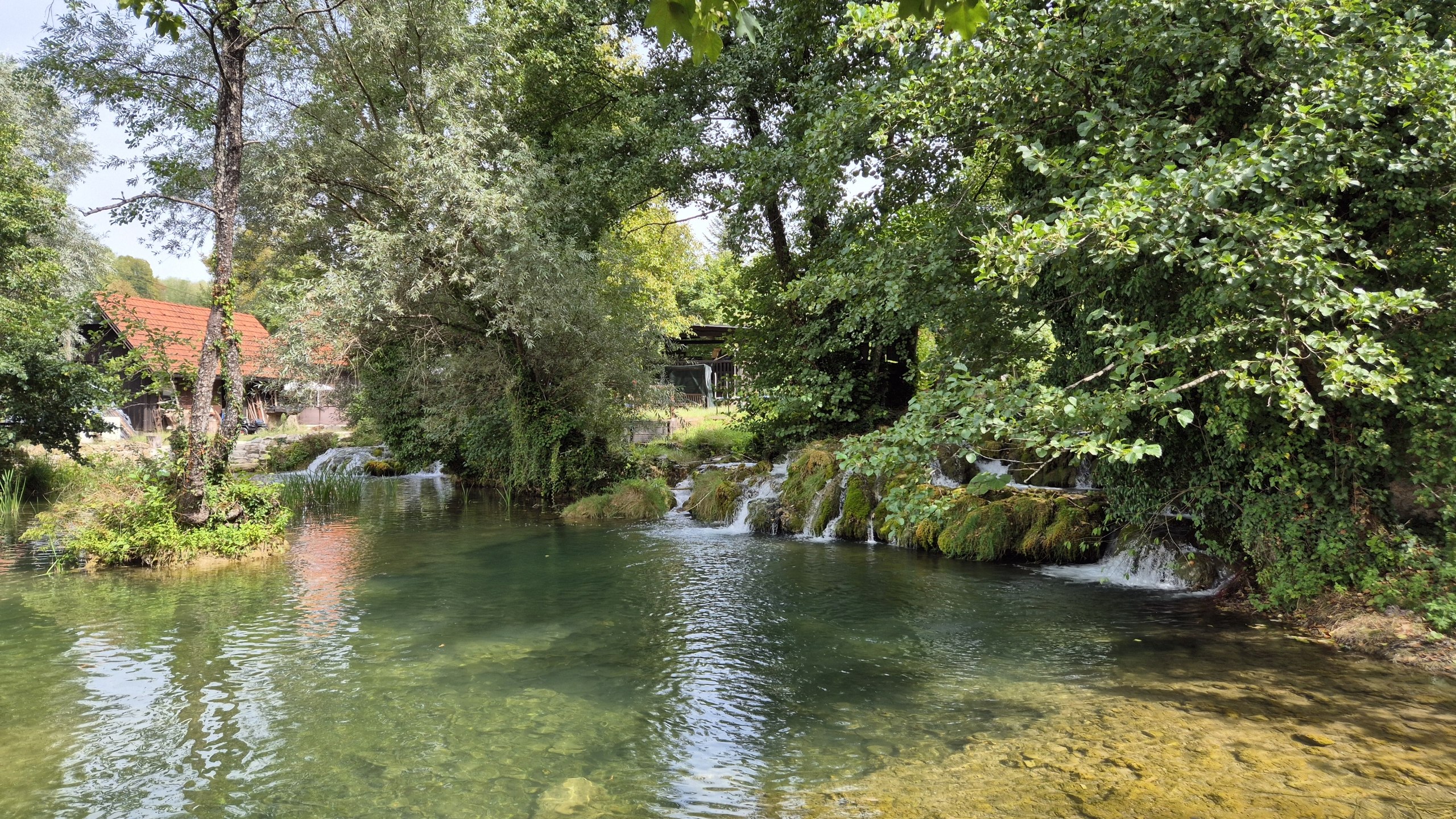 Mill channels and clear pools among the houses of Rastoke