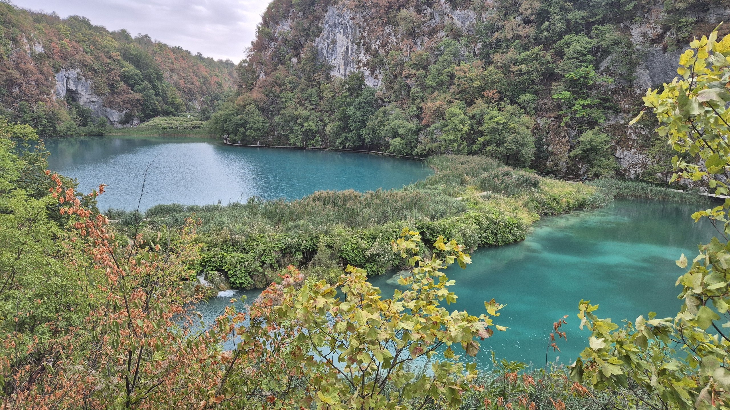 A waterfall beside the wooden boardwalk at Plitvice Lakes