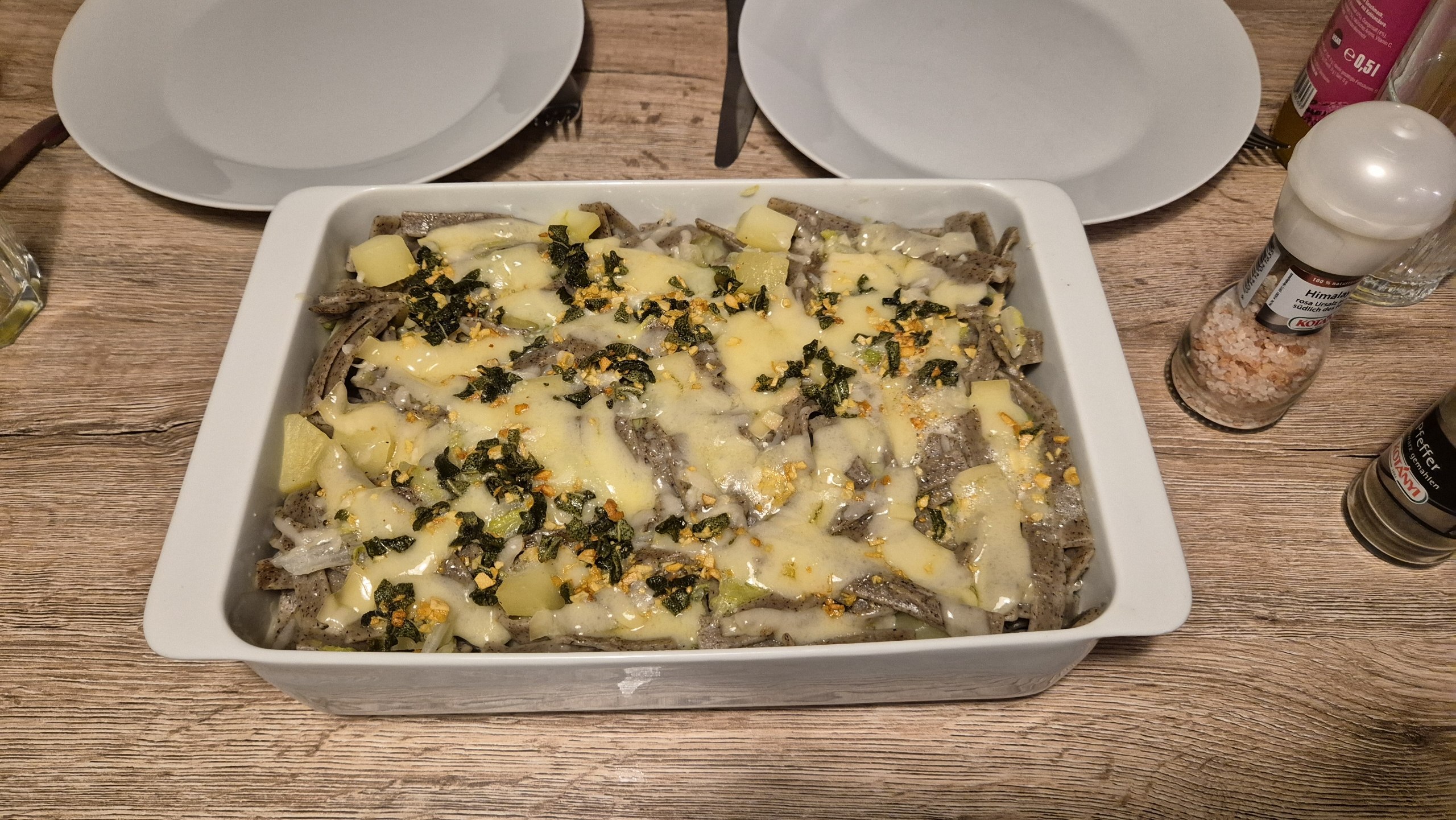 Homemade pizzoccheri with buckwheat pasta, potatoes, napa cabbage and cheese
