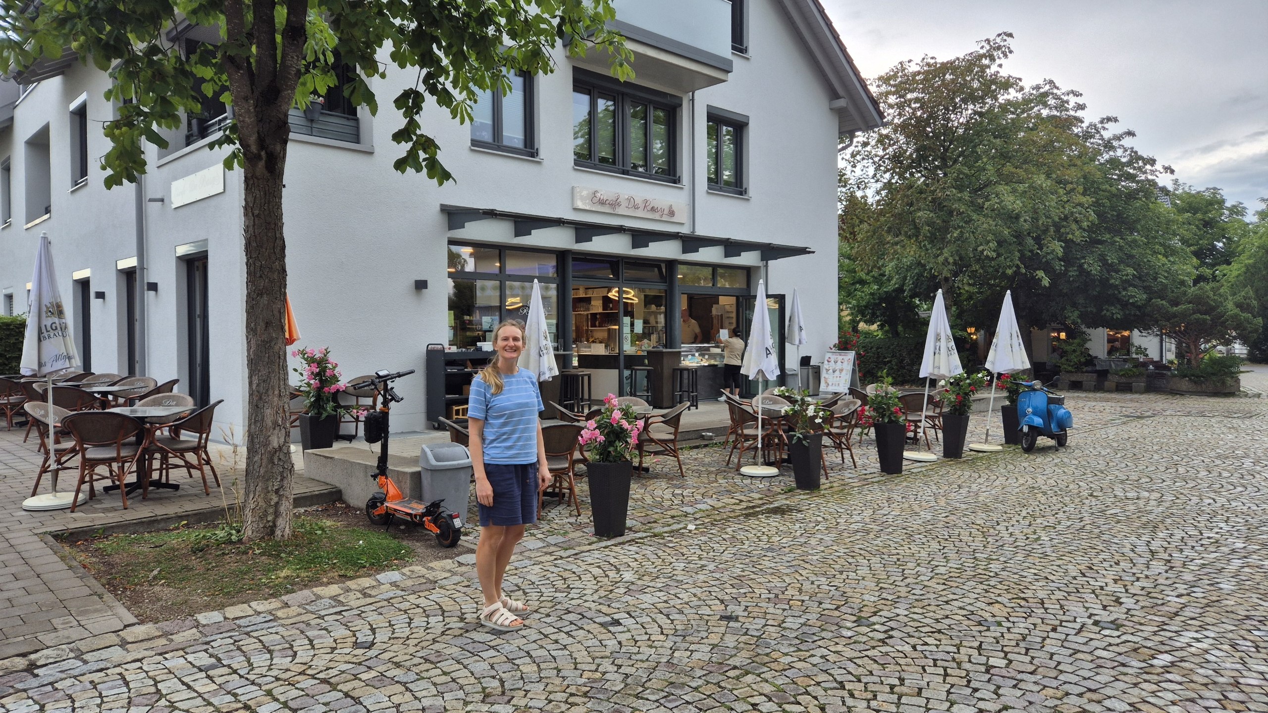 Caro outside the ice cream shop after rain interrupted the cycle ride