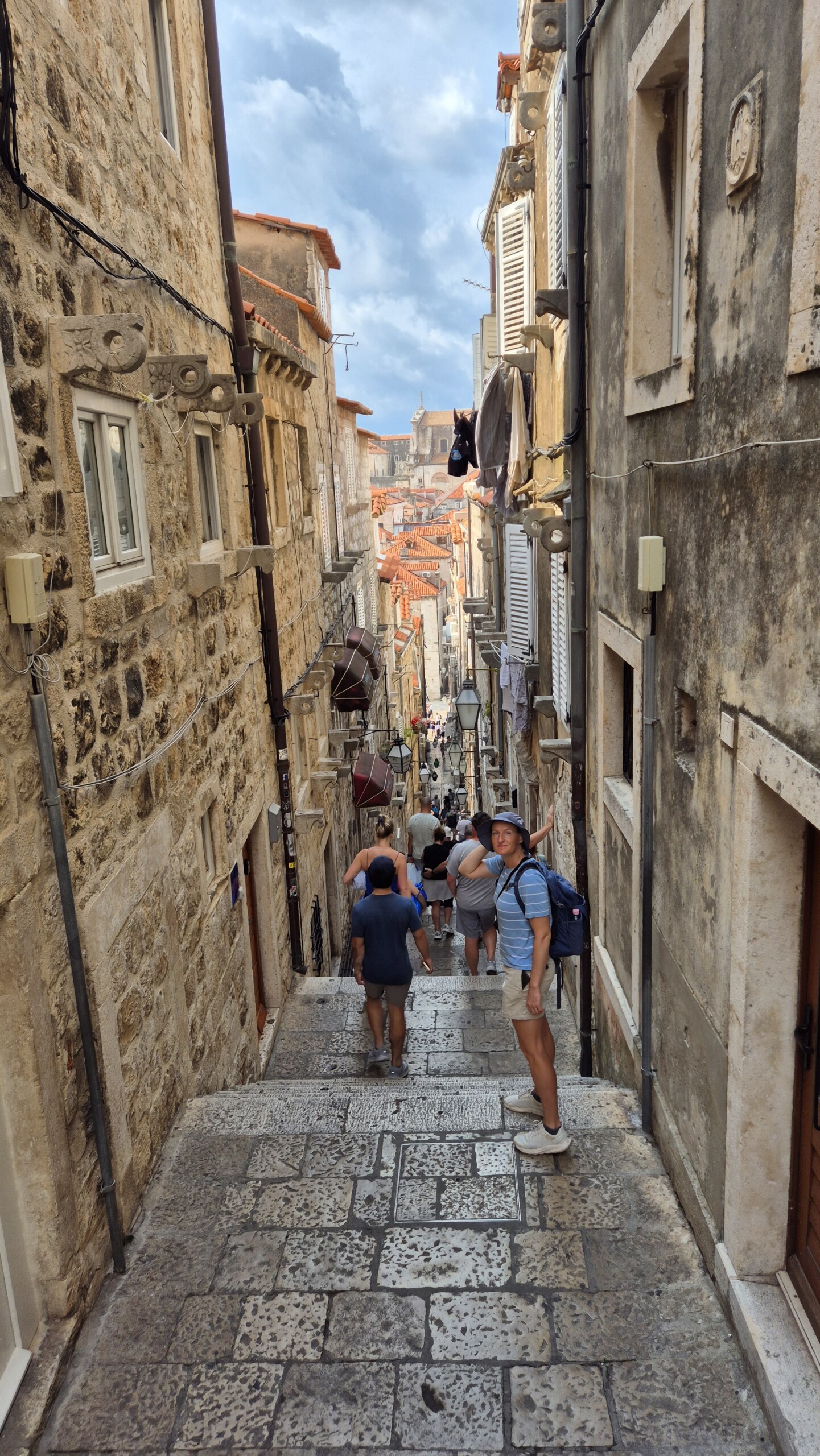 20260911_094217 A narrow stepped lane descending inside Dubrovnik's Buza Gate