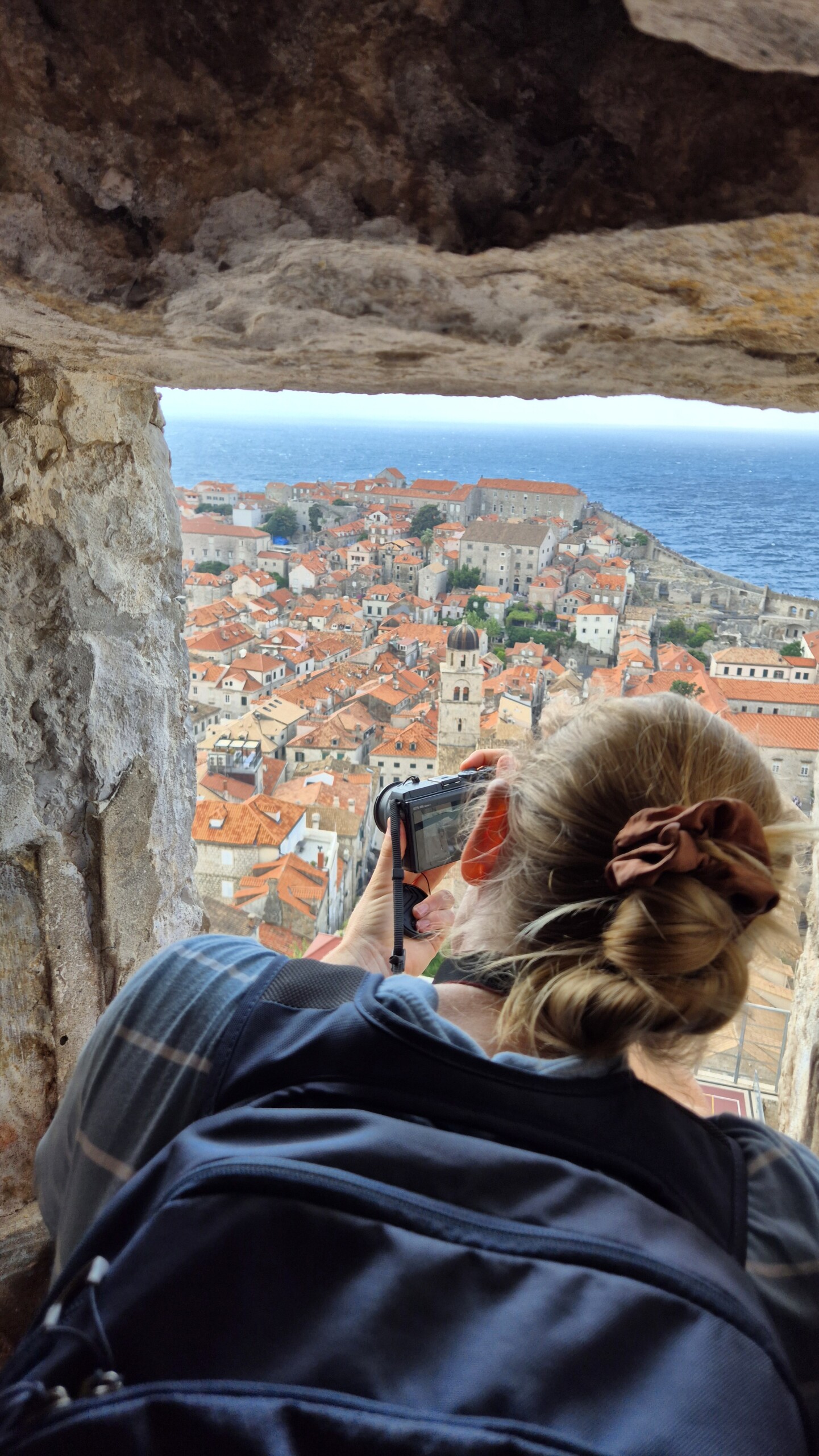 20260911_111736 Caro looking through an opening in Dubrovnik's city walls