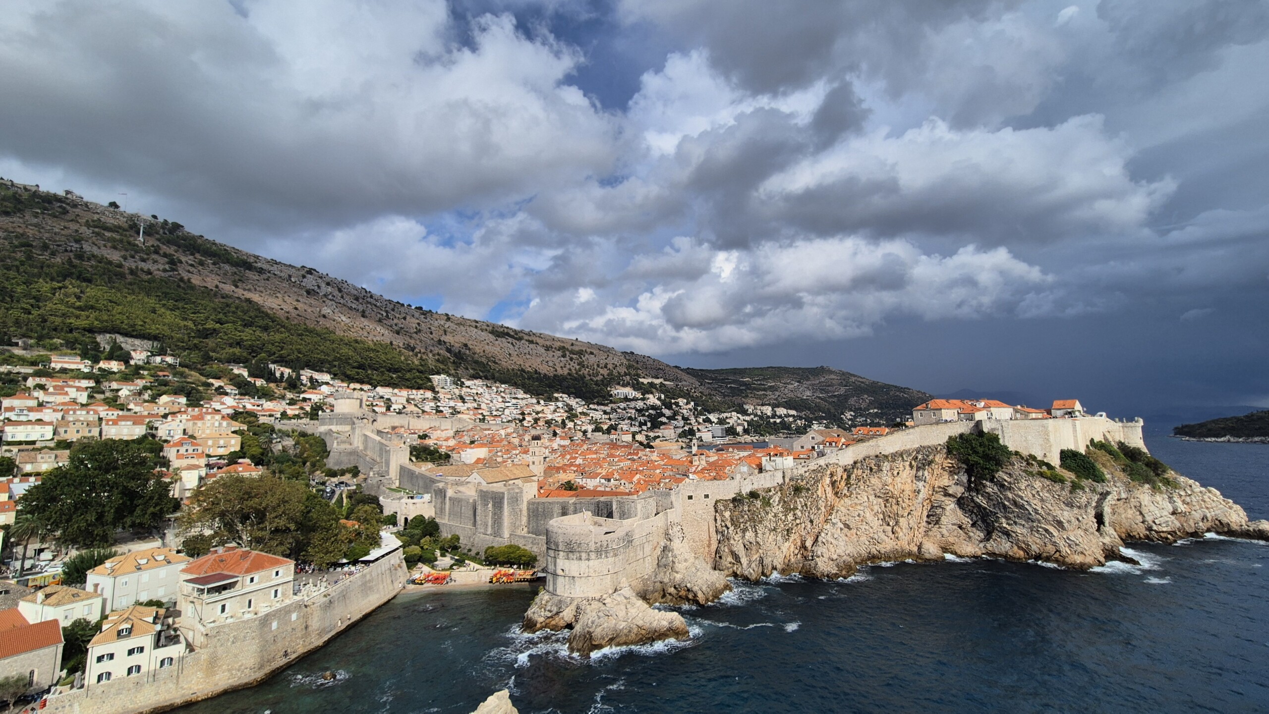 Dubrovnik Old Town glowing beneath dramatic storm clouds