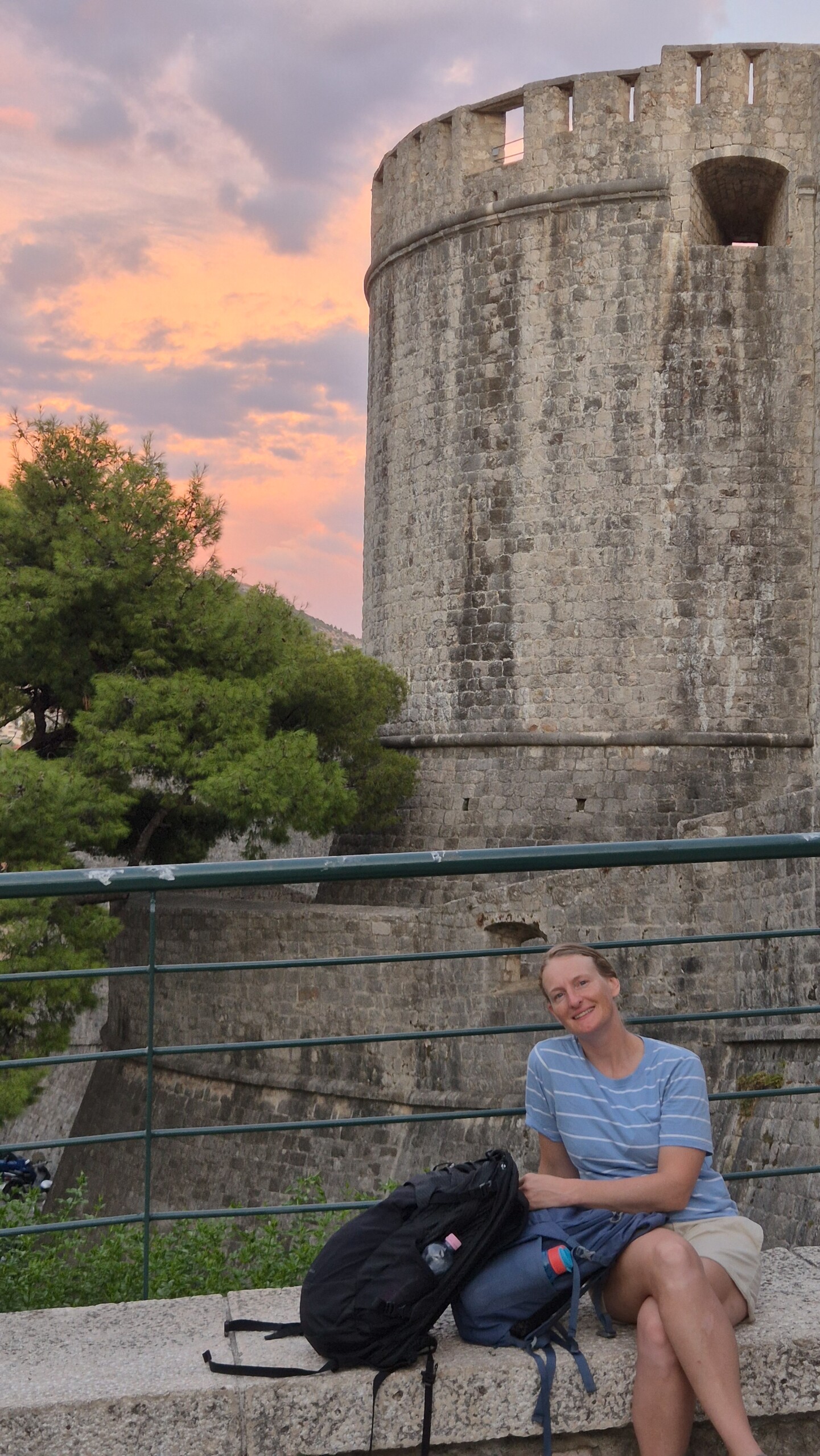 20260911_190413 Caro resting near Dubrovnik's walls after a long day