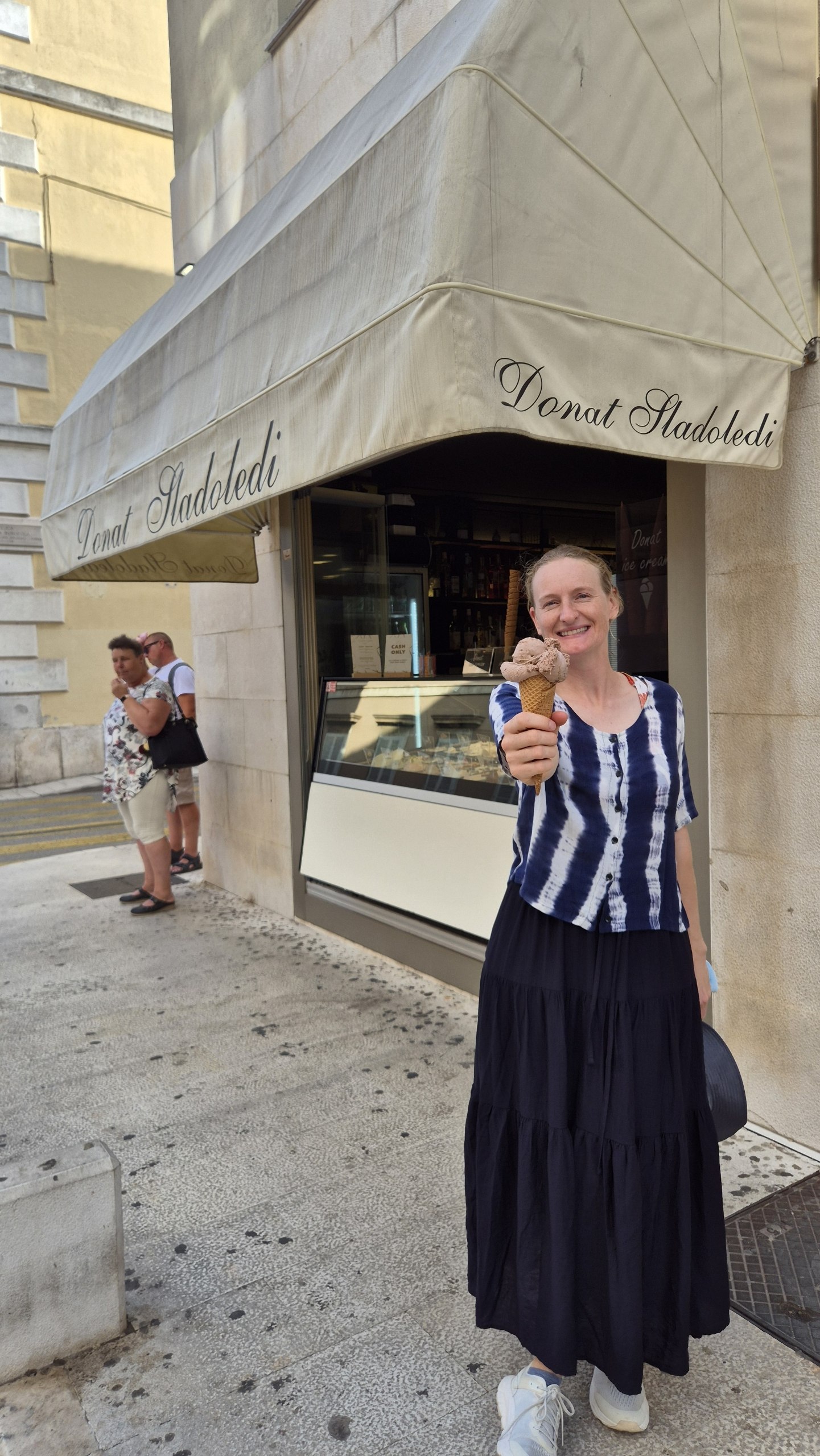 Caro eating Dubai Chocolate ice cream in Zadar's old town