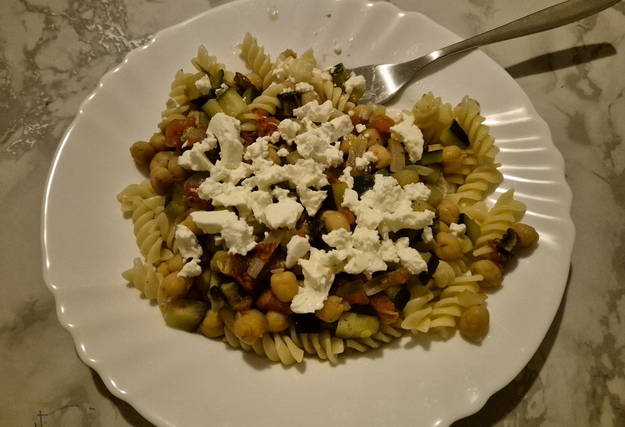 Pasta with chickpeas, baby marrow, mushrooms, tomatoes and feta
