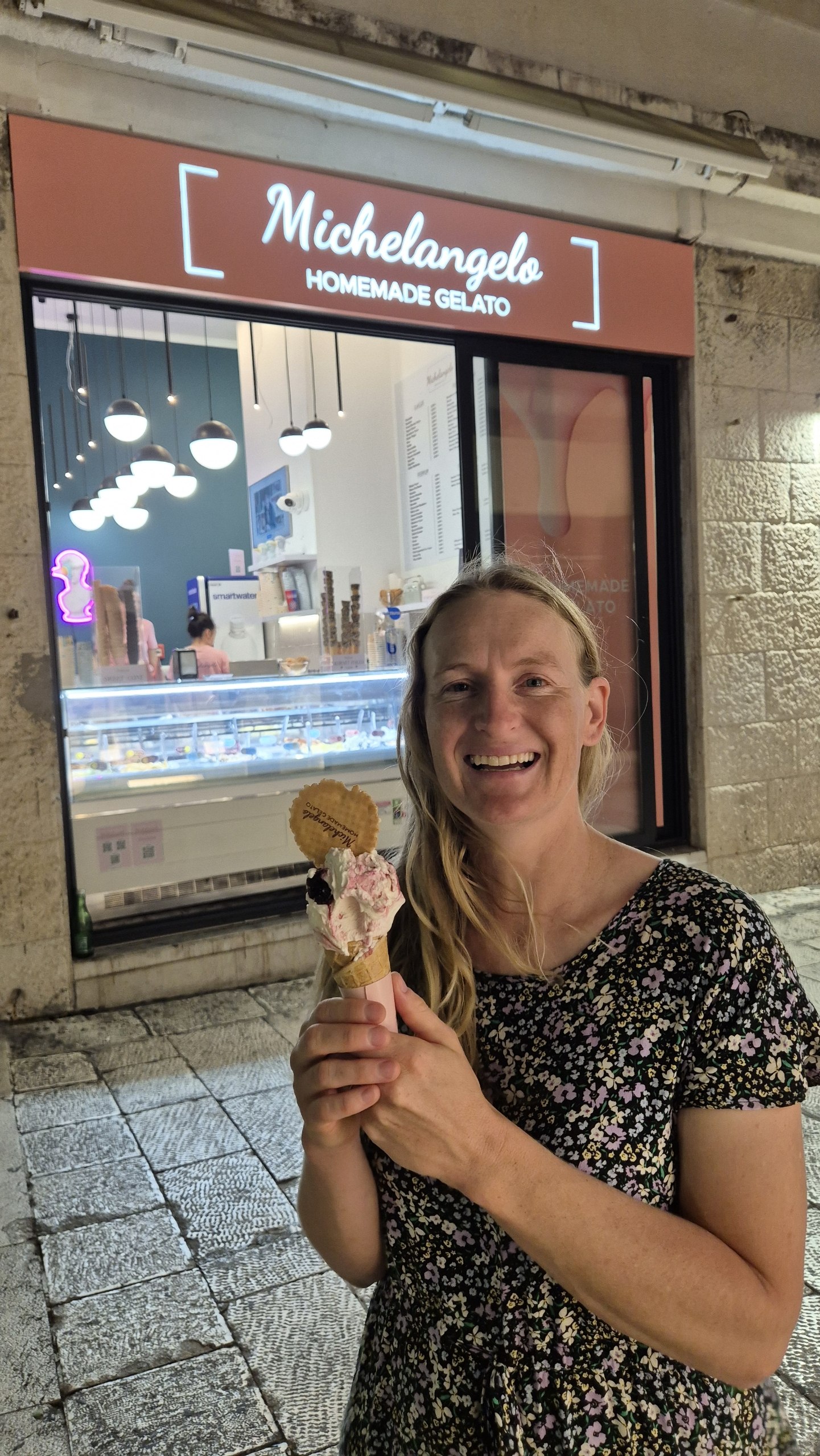 Caro holding cherry and cream frozen yoghurt in Split