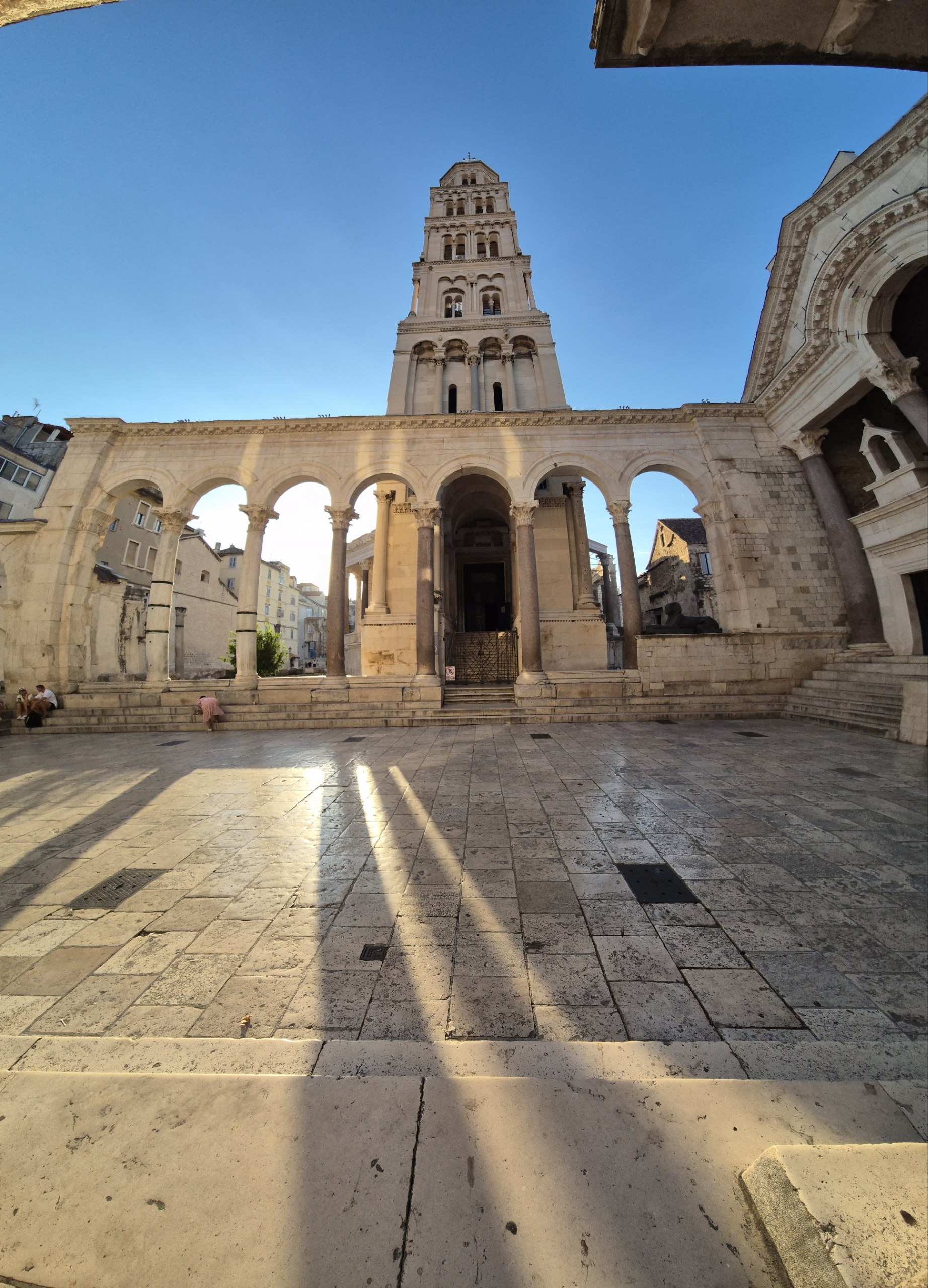 The quiet Peristyle and Cathedral of Saint Domnius bell tower in early morning light