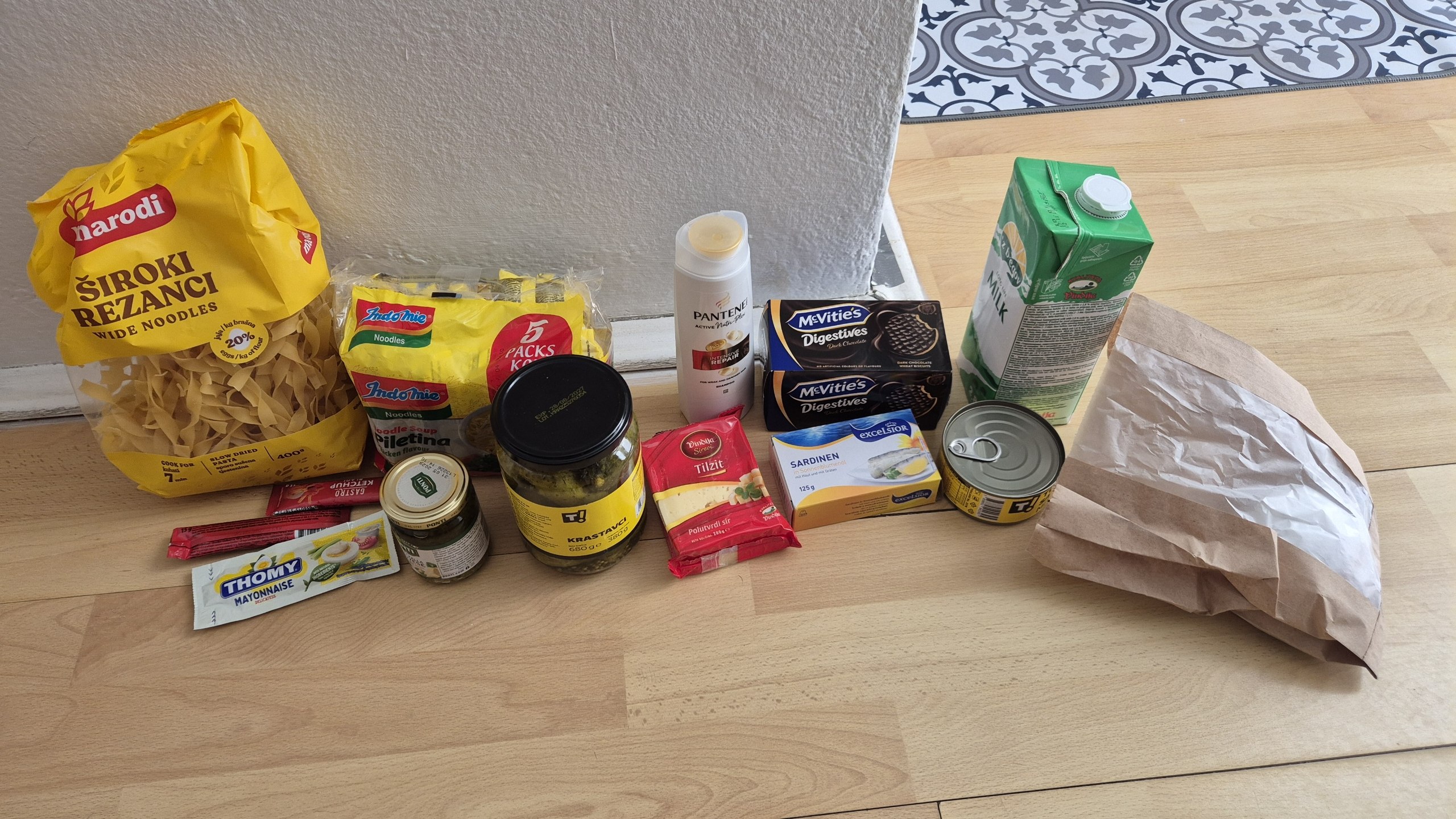 Groceries spread across a table in the apartment in Stari Grad