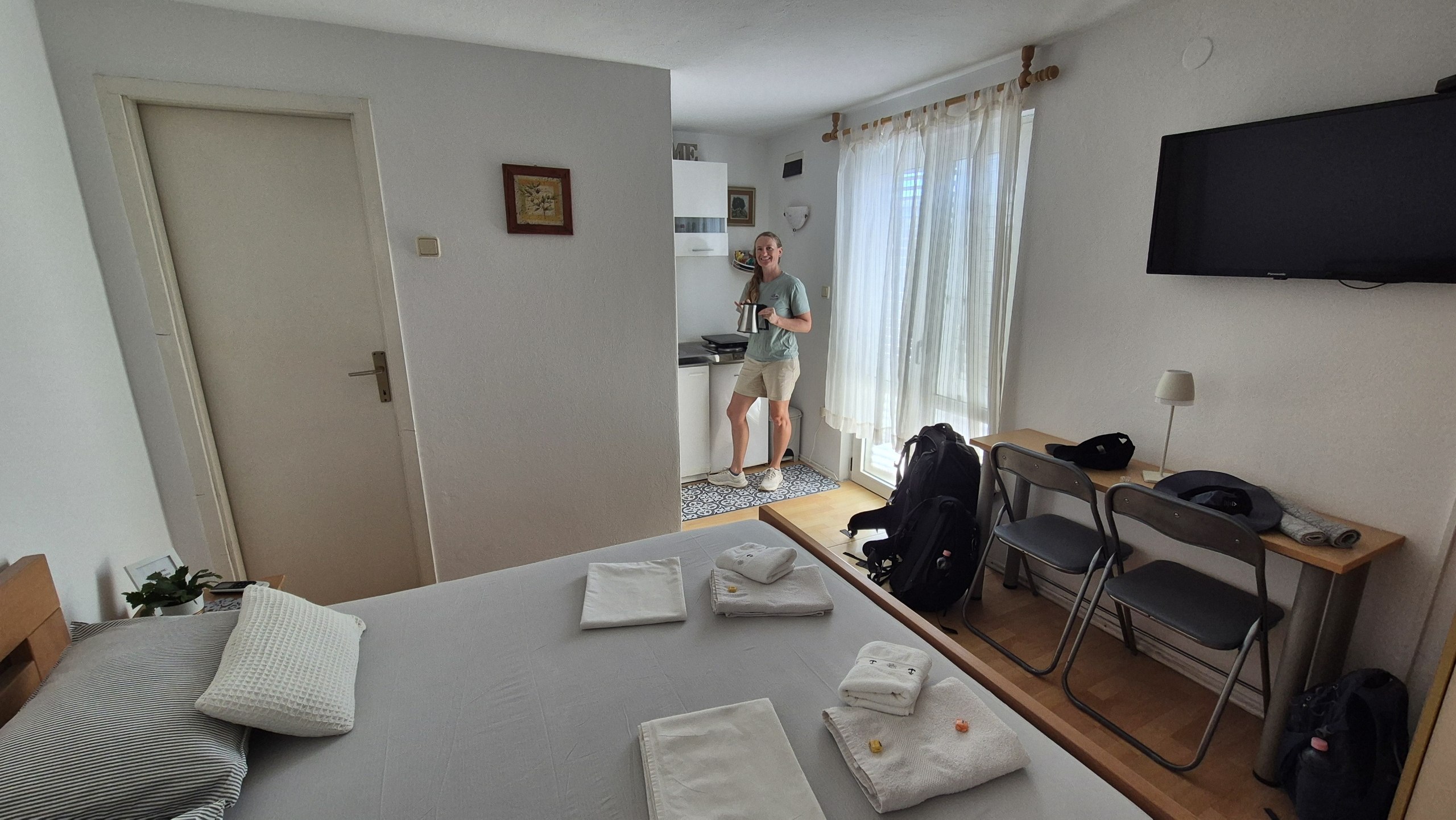 Caro standing in the small apartment in Stari Grad after check-in