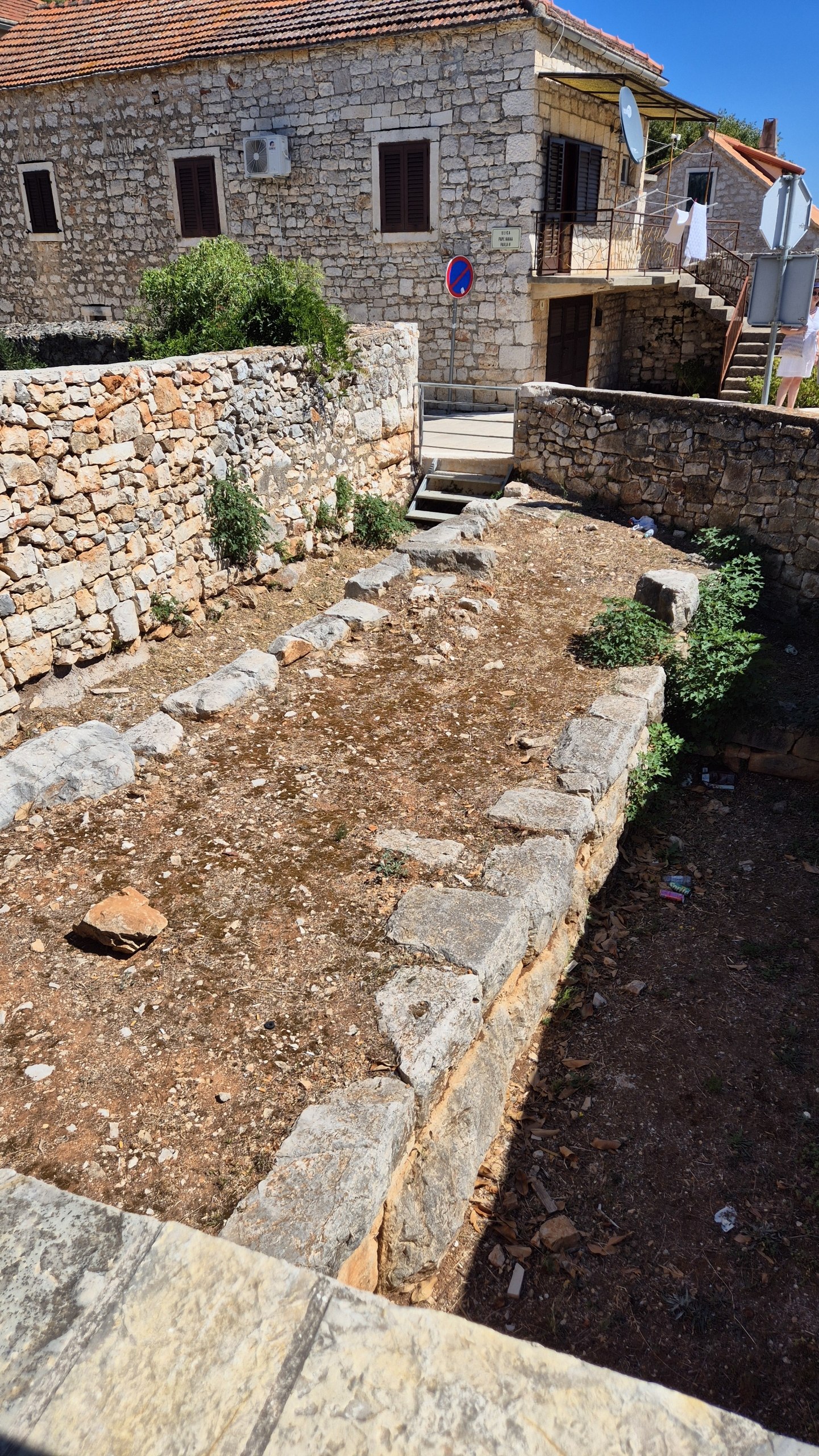 Preserved stone foundations and city wall remains of ancient Pharos in Stari Grad