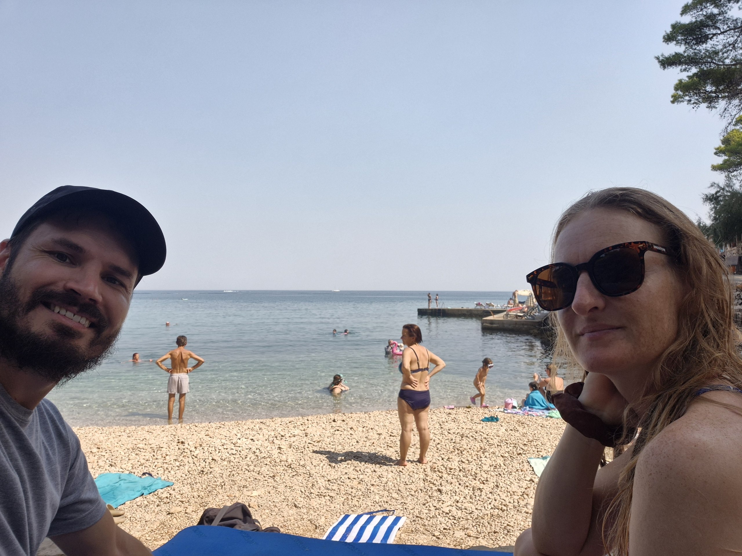 Hugo and Caro at a busy pebble beach between Jelsa and Vrboska