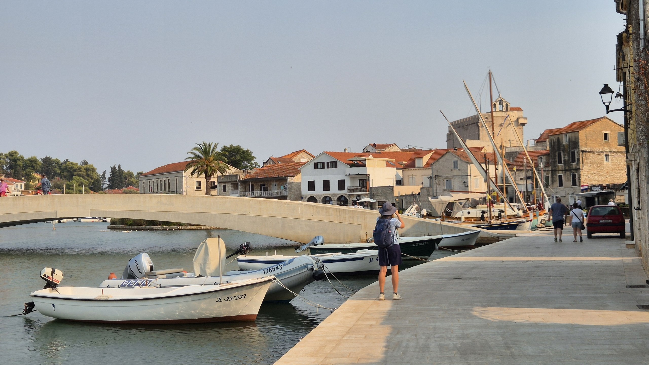 Small boats and a bridge along the Vrboska waterfront