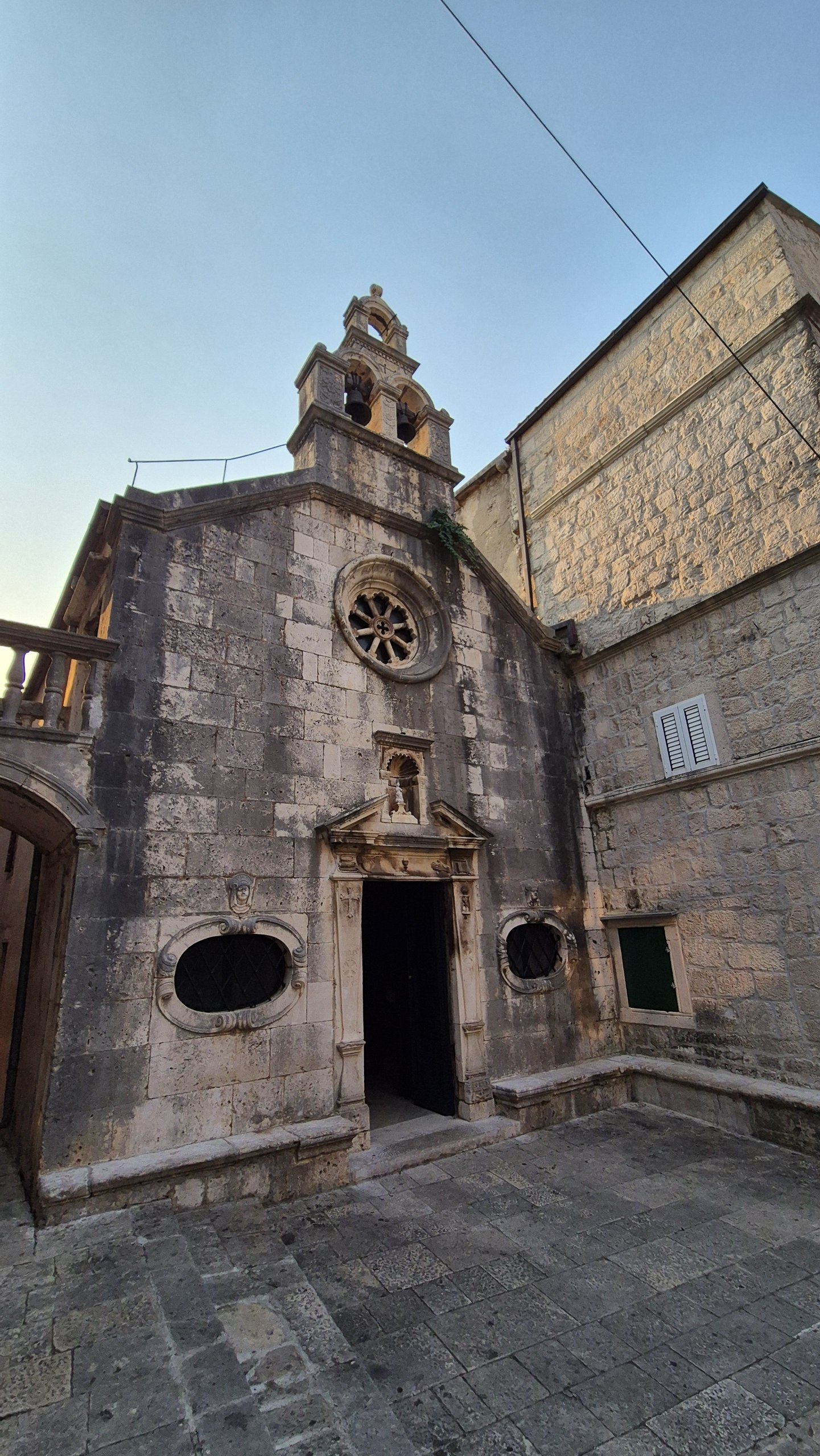 A small stone chapel in a quiet square in Korcula old town