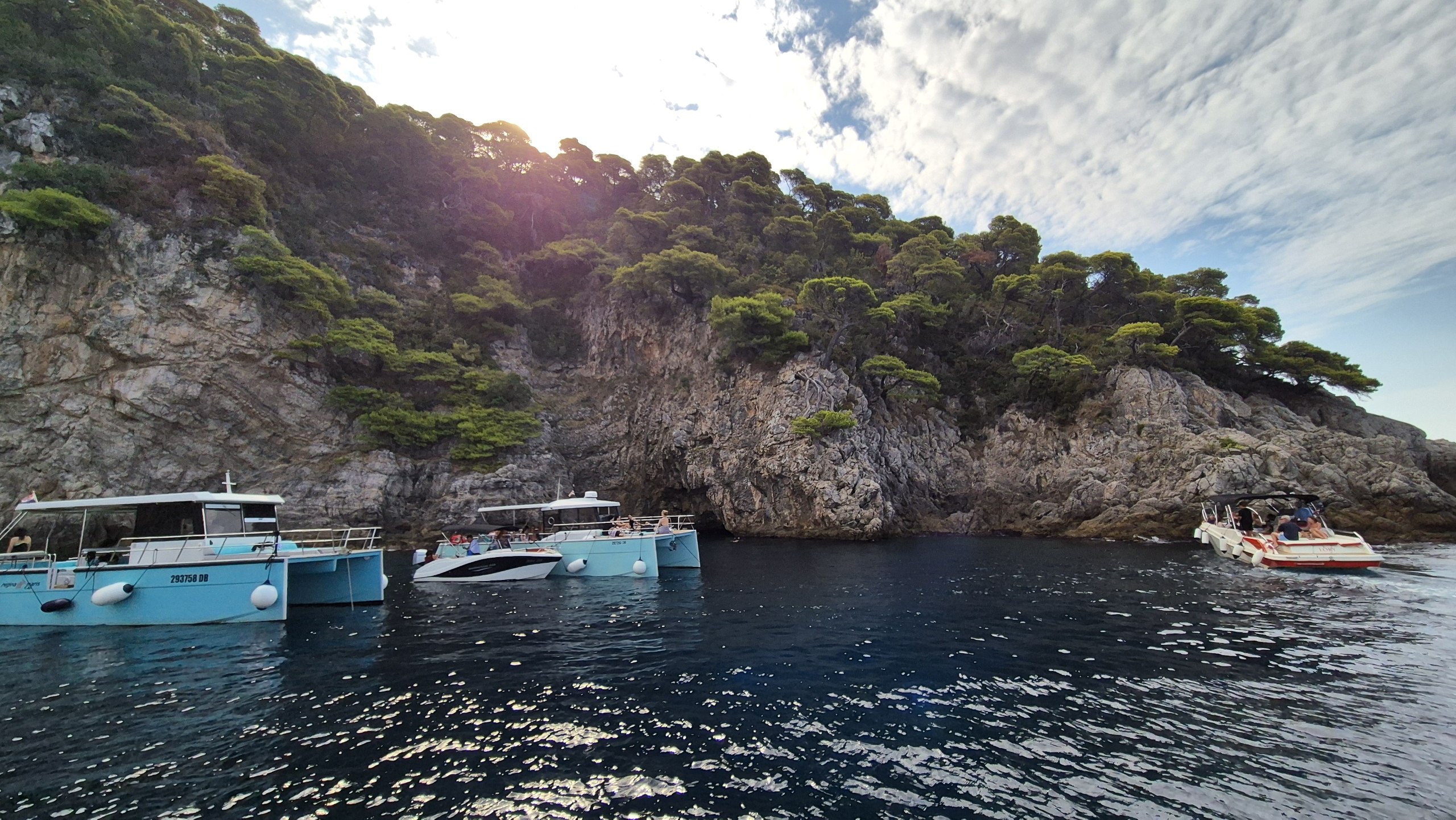 Tour boats gathering outside the Blue Cave on Kolocep