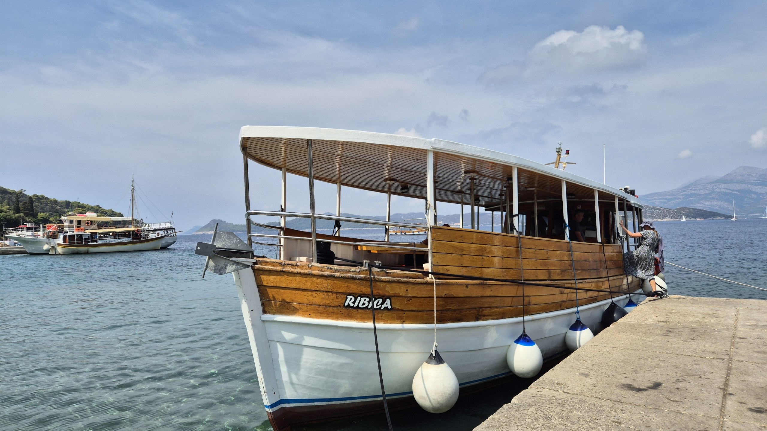 The wooden tour boat Ribica tied up at the quay