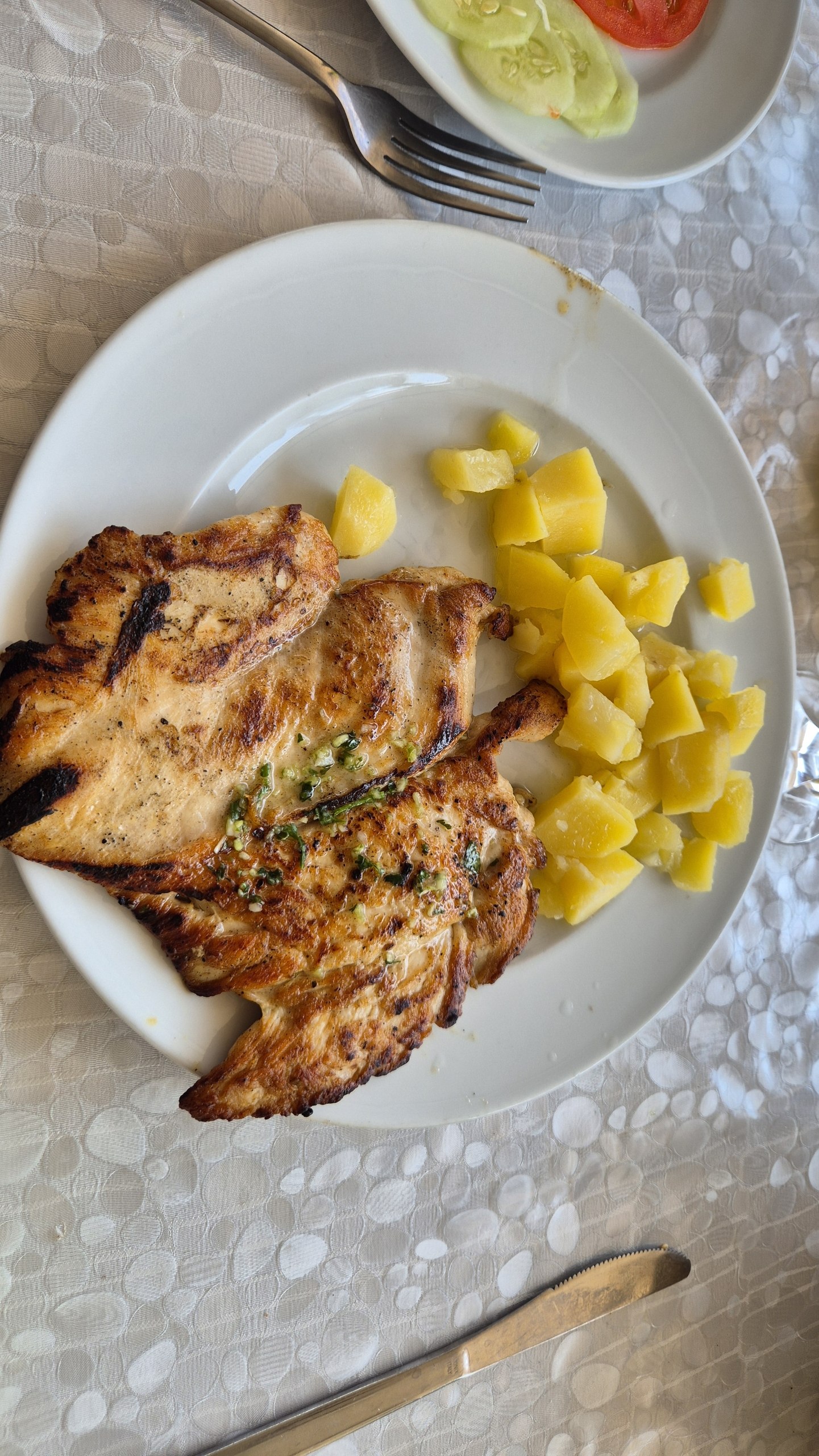 Grilled chicken with potatoes and salad for Hugo's lunch on Sipan