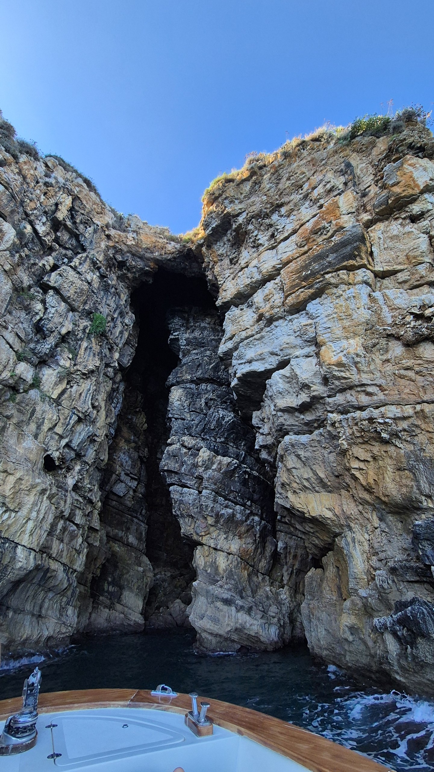 day49-boat-nosing-into-cave The bow of the boat nosing into a sea cave in the limestone cliffs