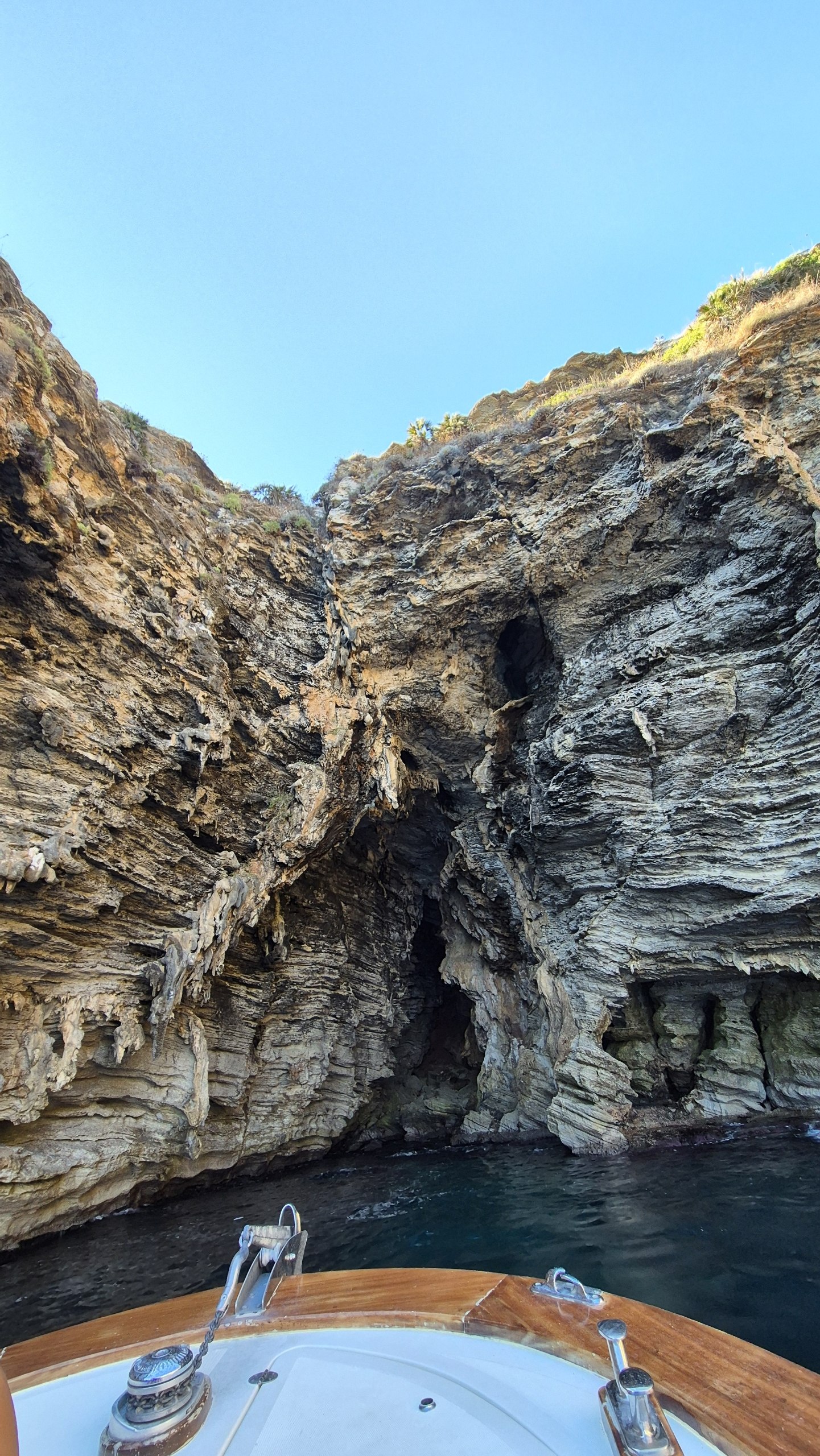 day49-sea-cave-cliffs Looking up at layered limestone above a sea cave