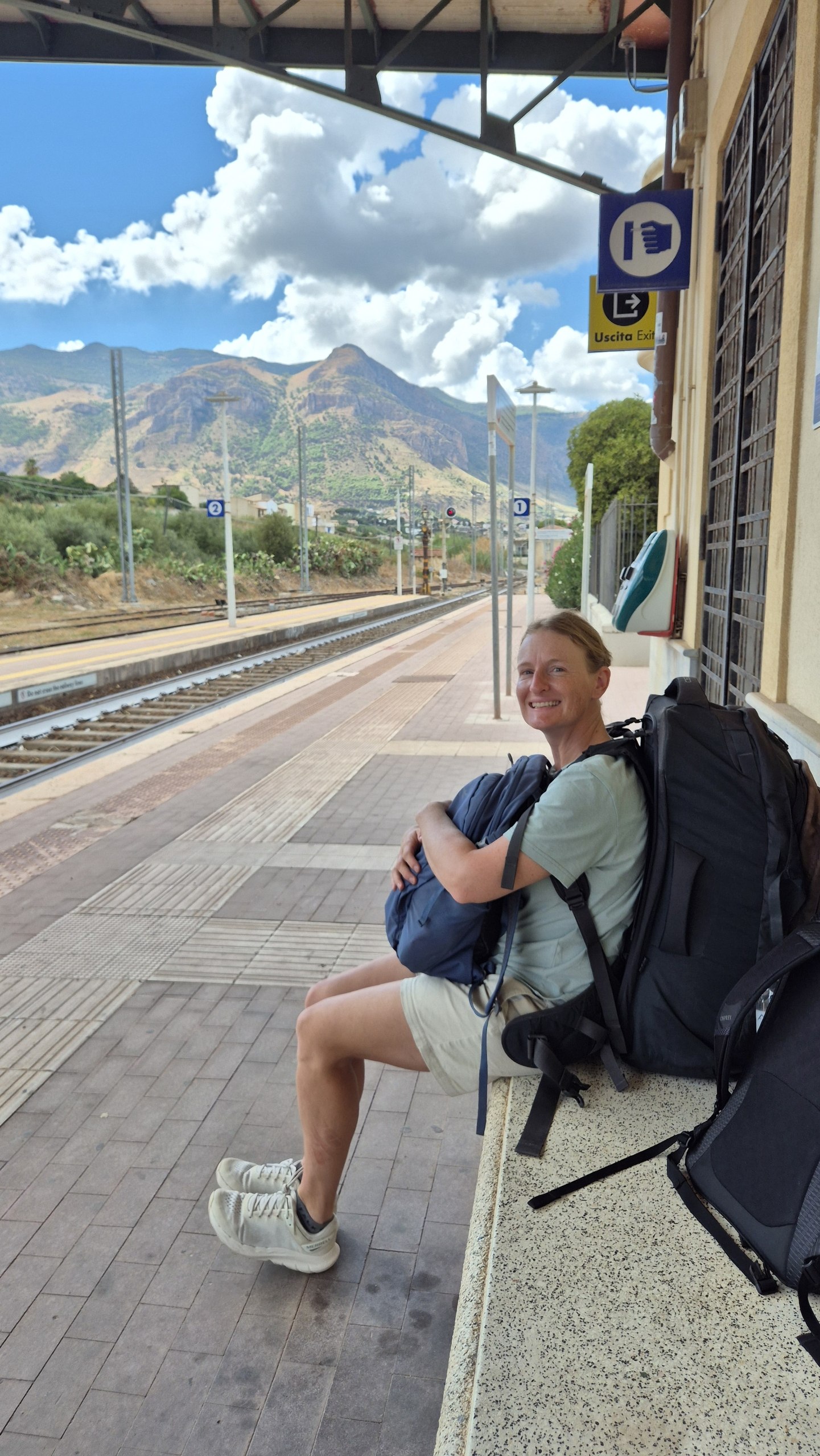 day50-castellammare-station Caro waiting with the backpacks at Castellammare del Golfo railway station