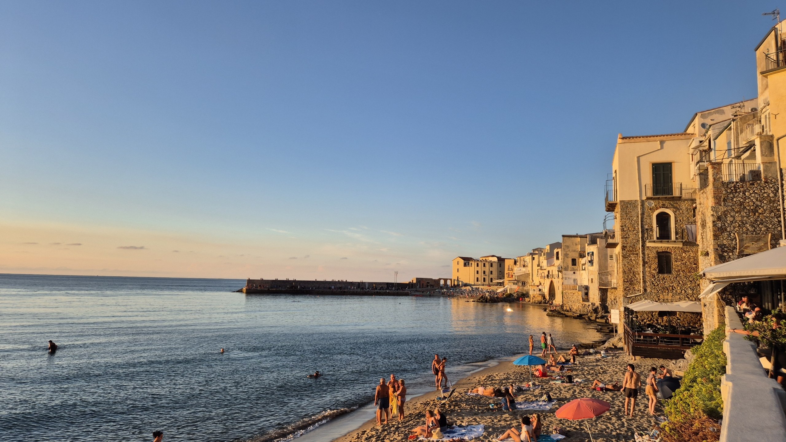 day52-cefalu-old-town-beach Cefalù's old town rising above the beach and the old pier