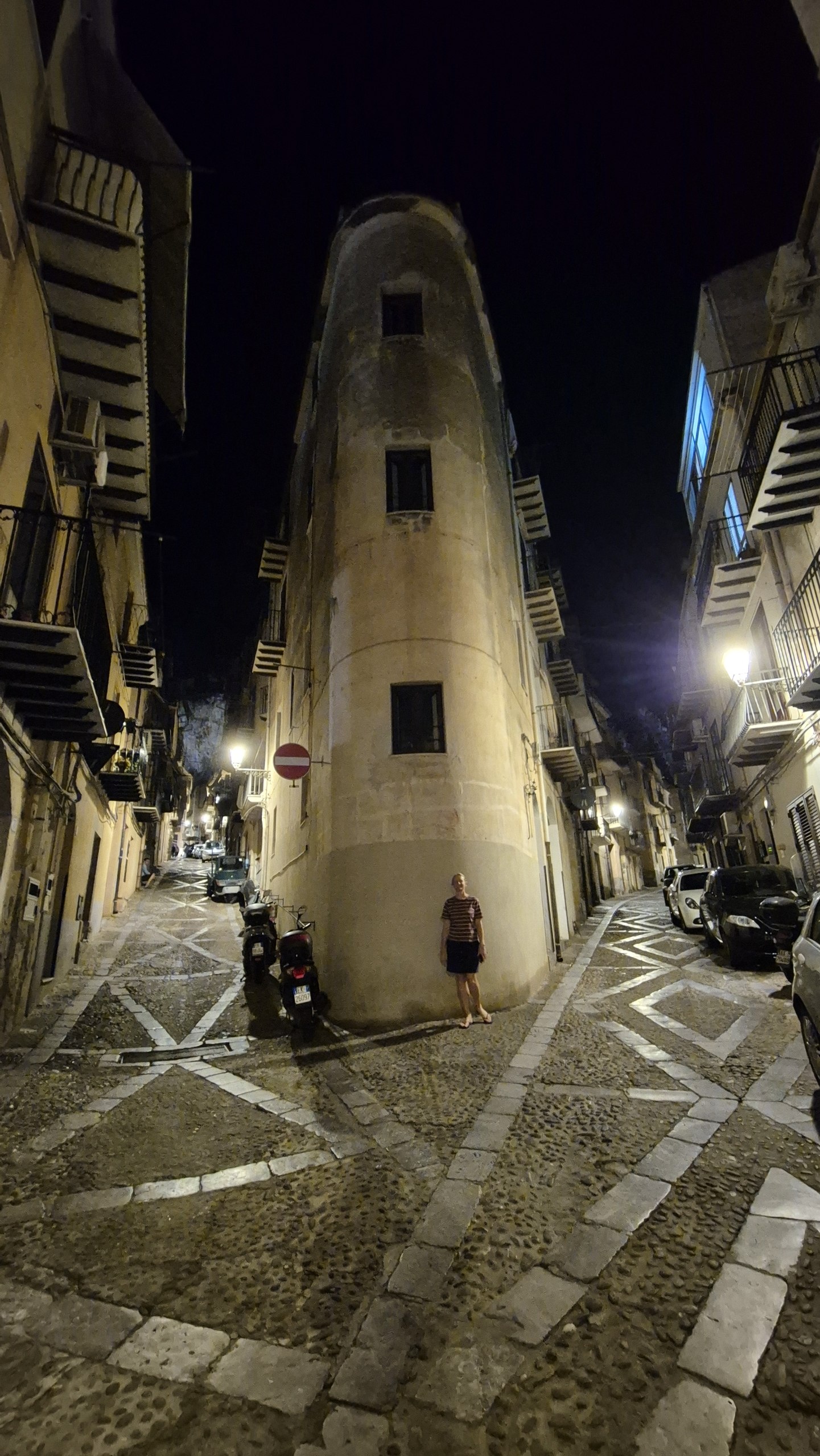 days53-54-caro-cefalu-narrow-street Caro at a fork between two narrow cobbled streets in Cefalù