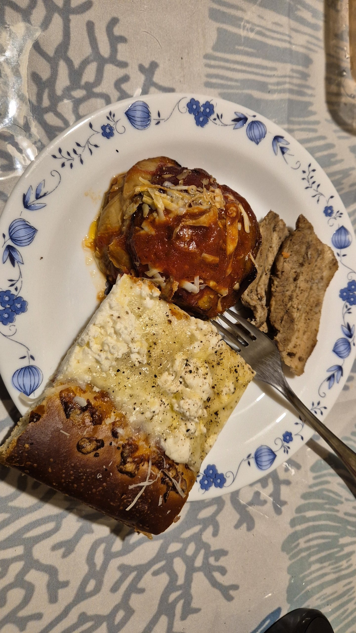 days53-54-cefalu-bakery-dinner Parmigiana di melanzane and a thick Sicilian bakery slice on a plate