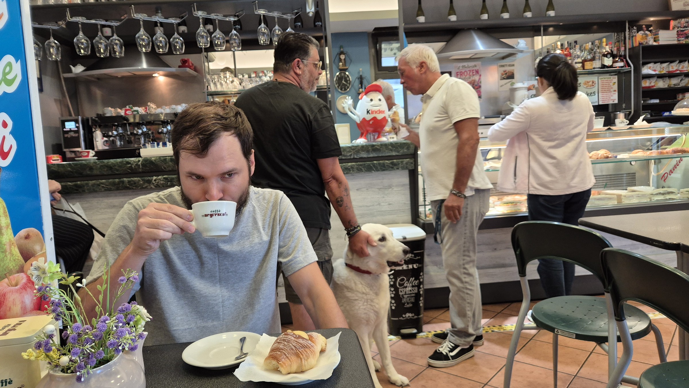 day65-coffee-and-cornetti Hugo having cappuccino and cream cornetti at the local coffee shop