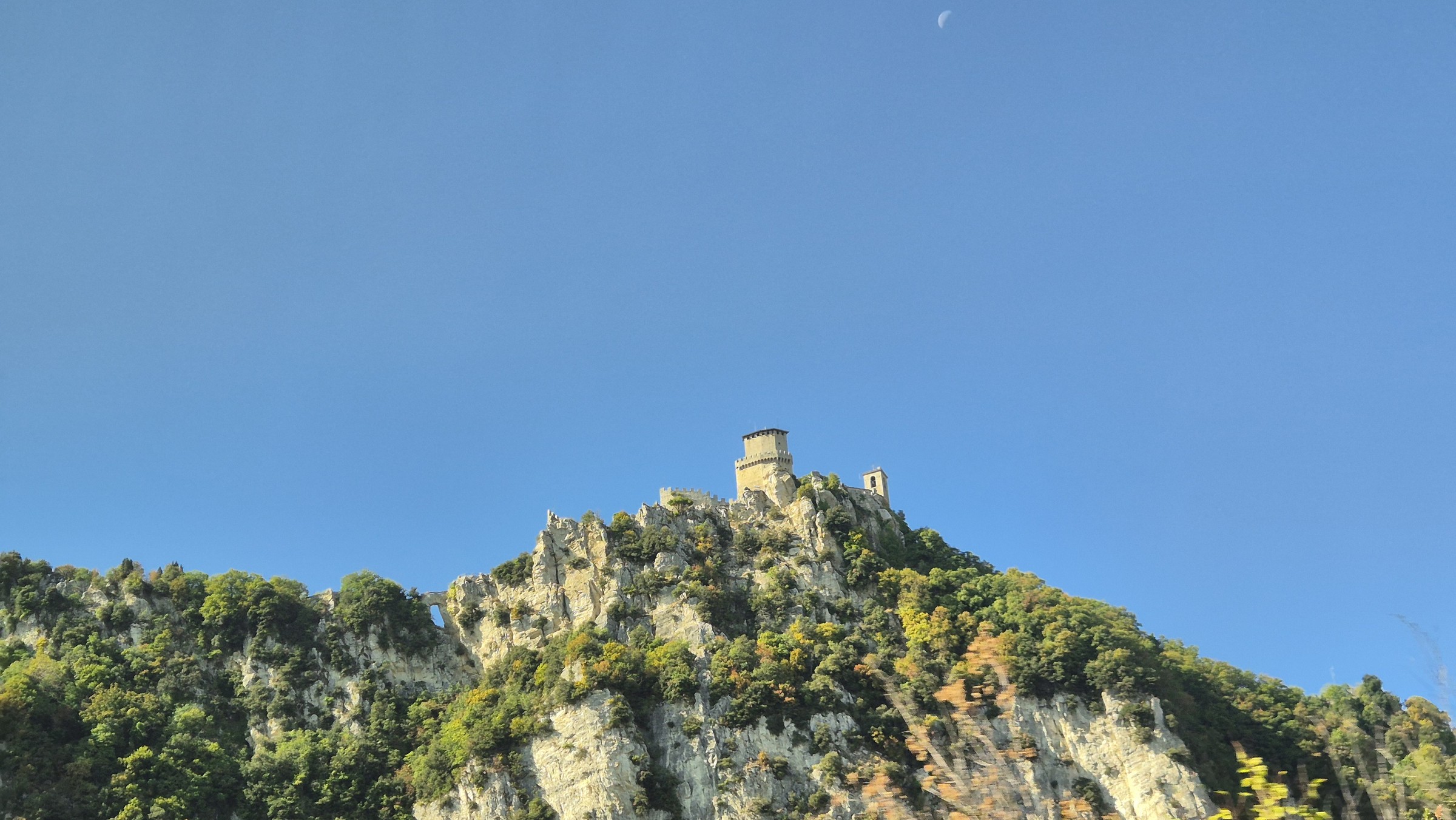 day69-san-marino-from-bus One of San Marino's towers high on Mount Titano as seen during the bus ride