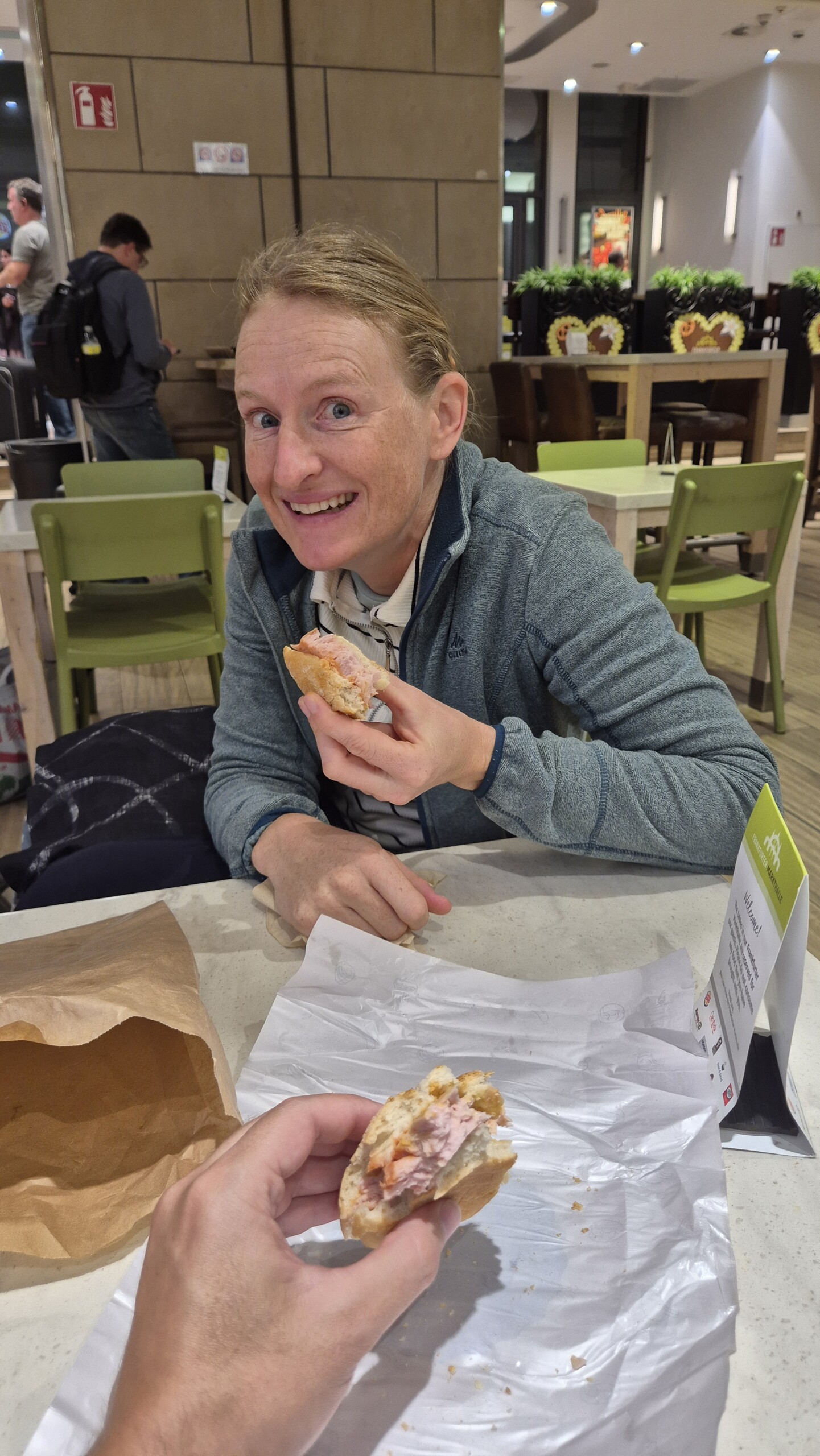 day71-caro-frankfurt-station Caro eating at Frankfurt Hauptbahnhof after the delayed journey